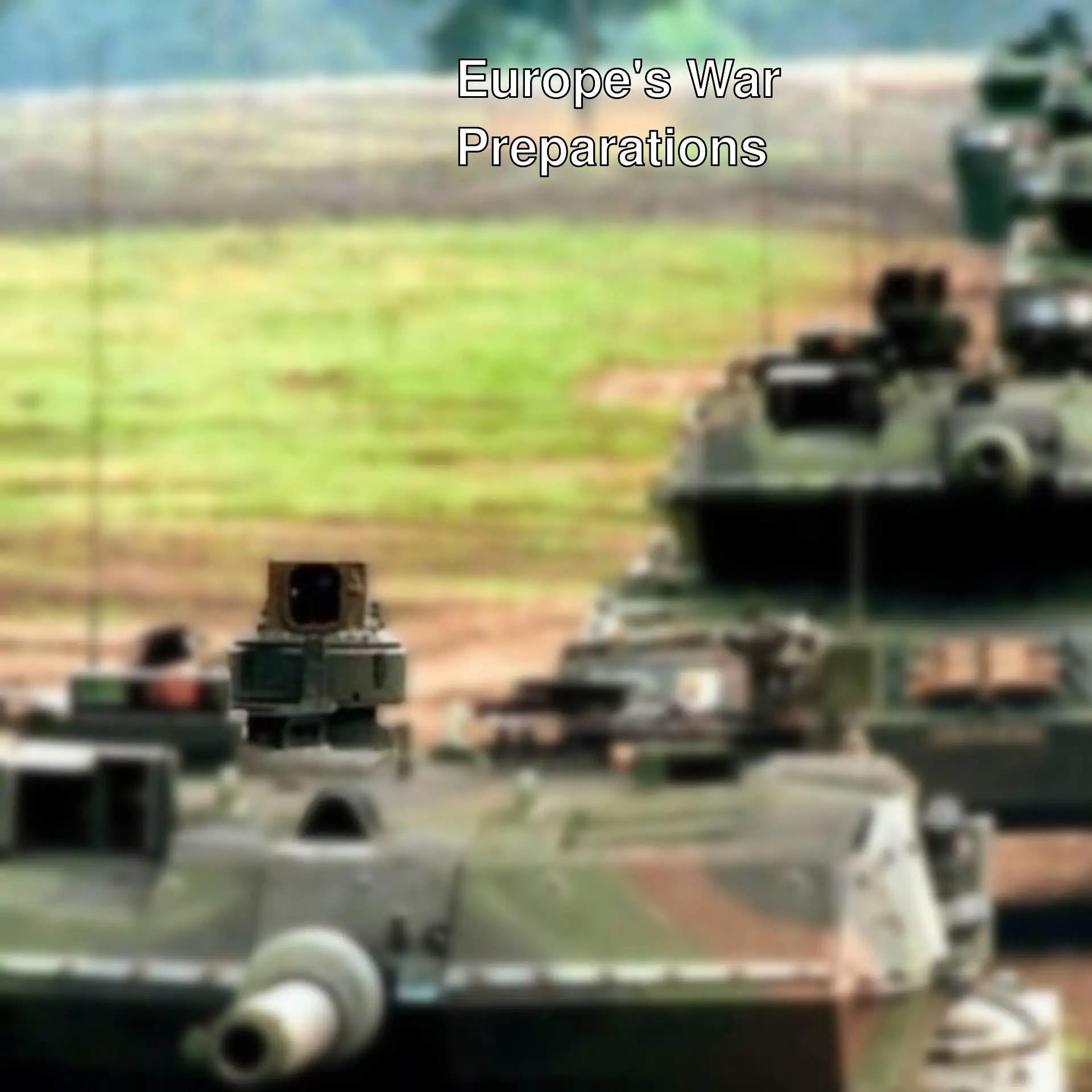 A group of military tanks driving on a field. A group of military tanks driving on a field.
