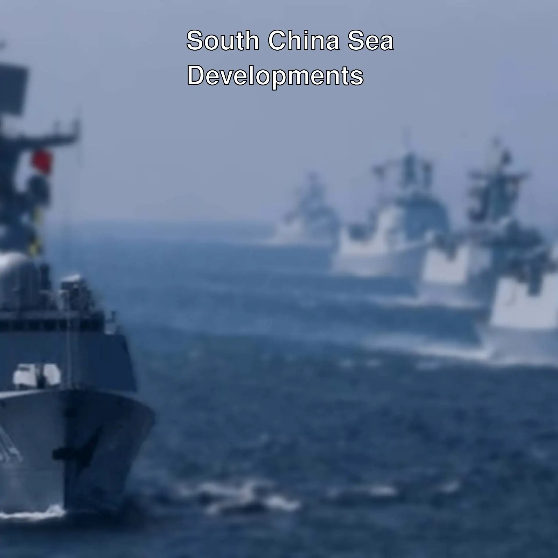 A group of military ships in the water.