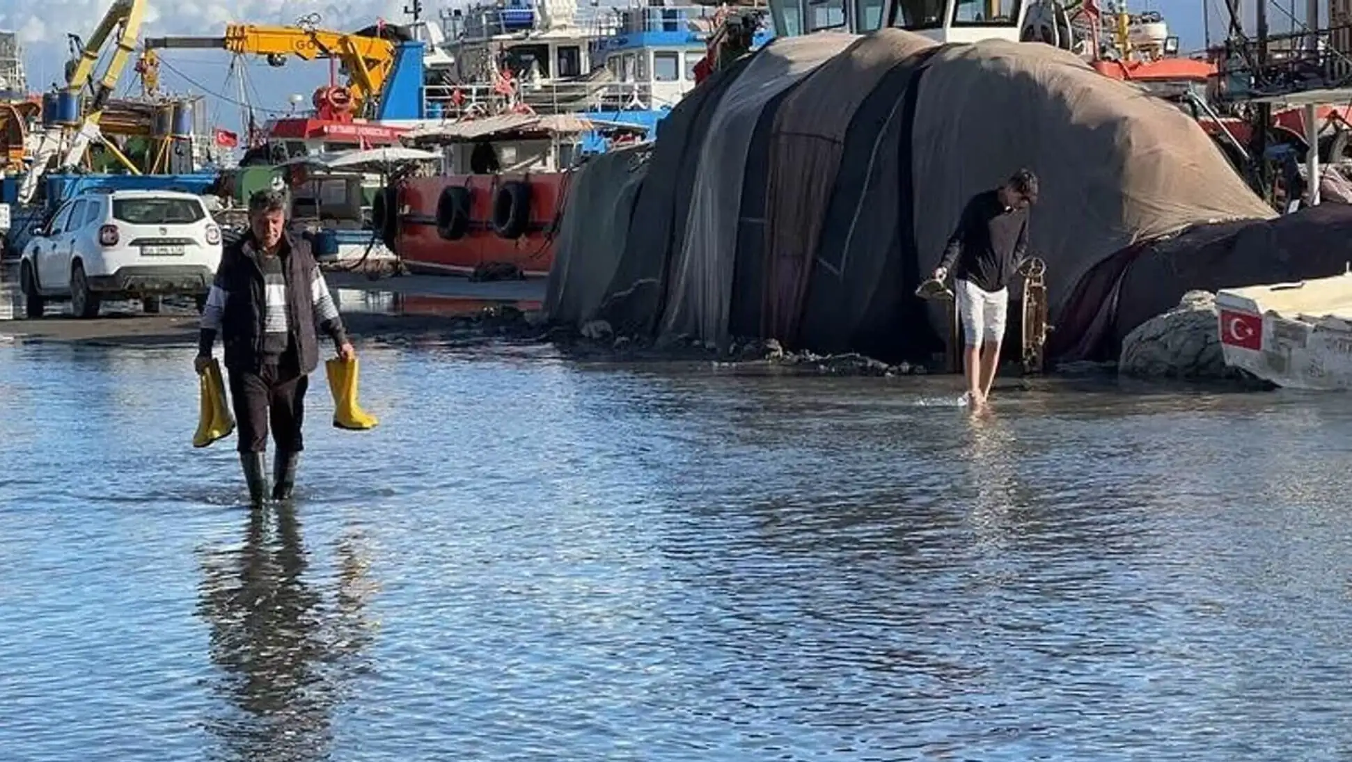 Two men walking in water. Two men walking in water.