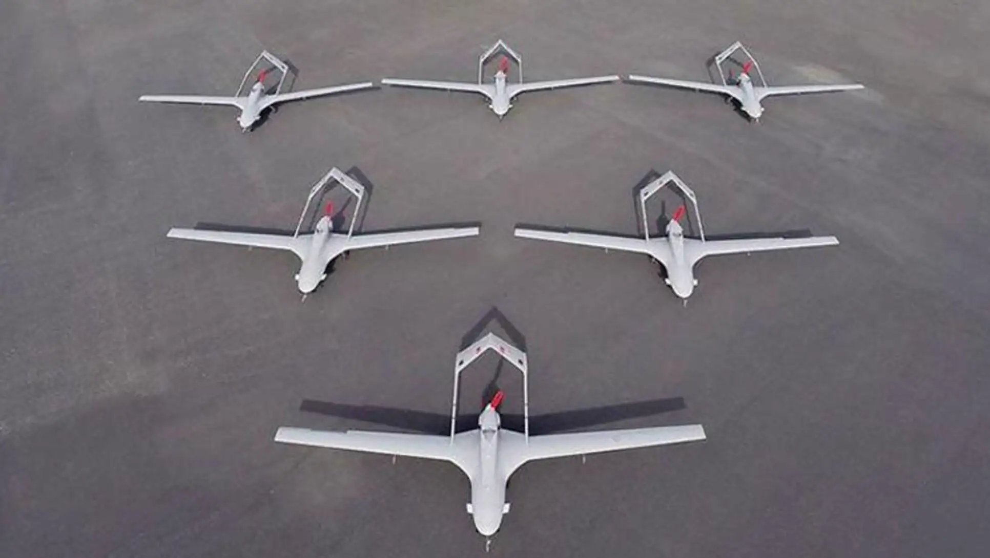 A group of airplanes on the ground. A group of airplanes on the ground.