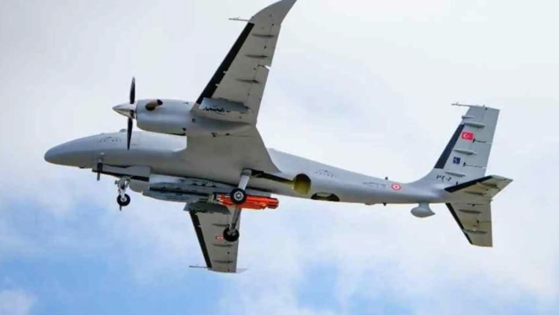 An airplane with a bullet attached to its wing. An airplane with a bullet attached to its wing.