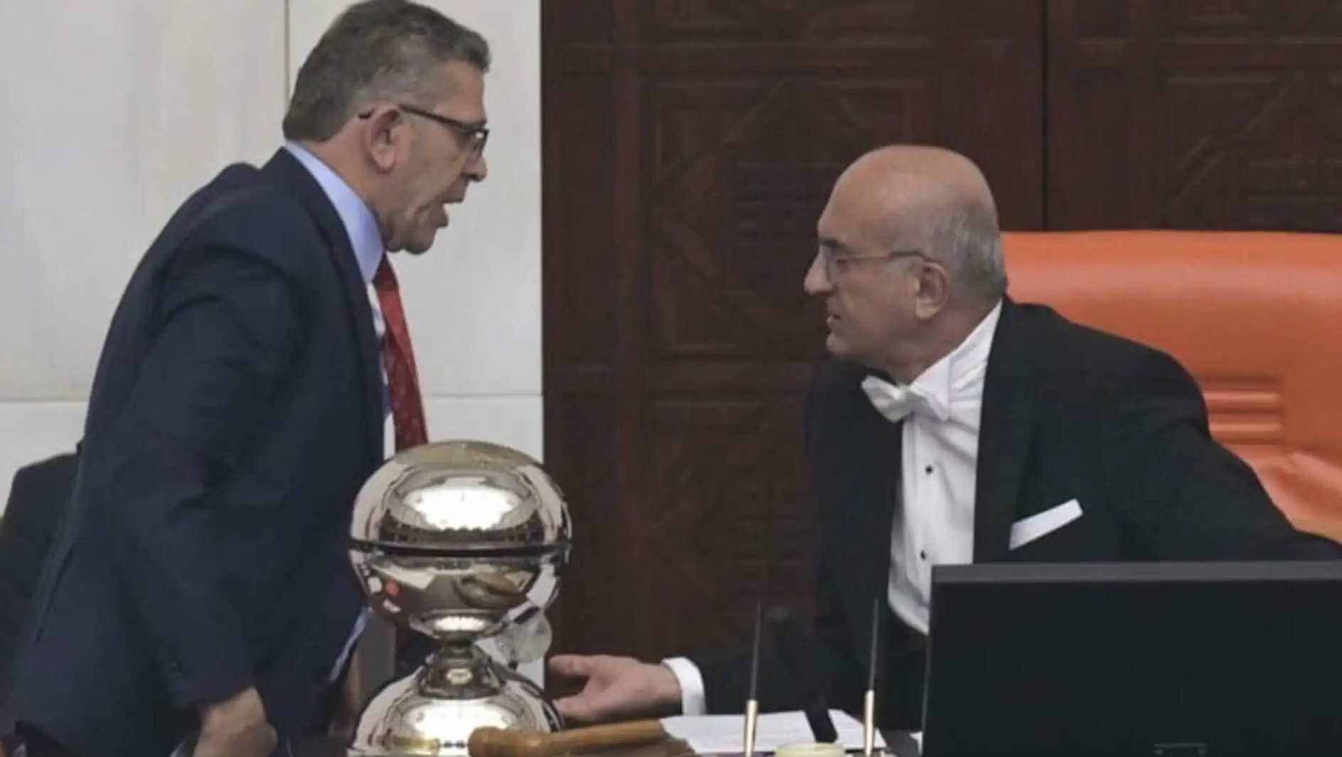 Two men talking to each other in a meeting. Two men talking to each other in a meeting.