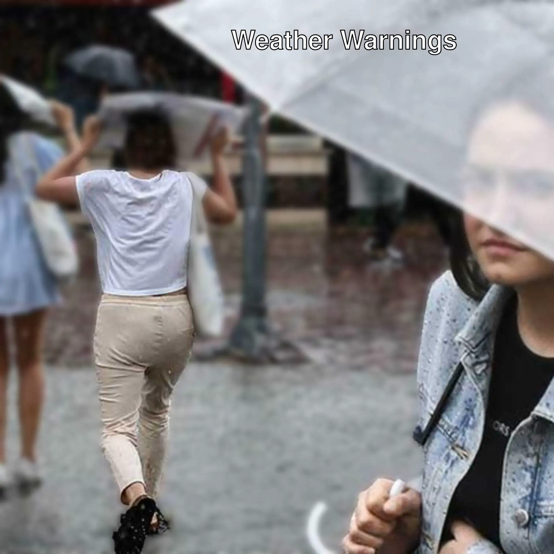 Women holding umbrellas in the rain.