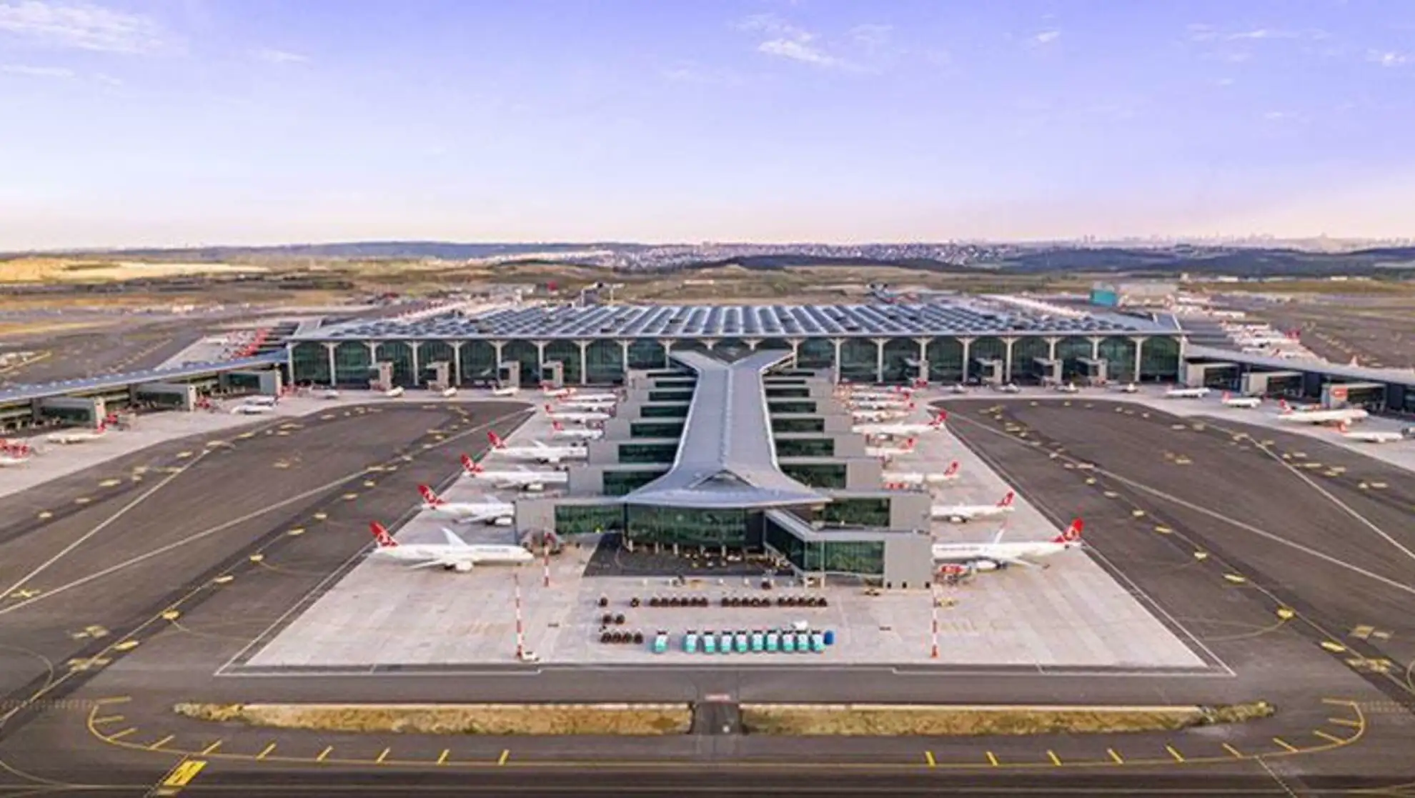 An airport with planes parked on the ground. An airport with planes parked on the ground.