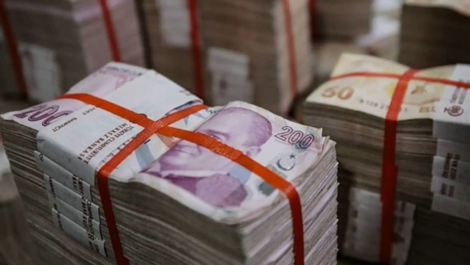Bundles of money tied with rubber bands. Bundles of money tied with rubber bands.