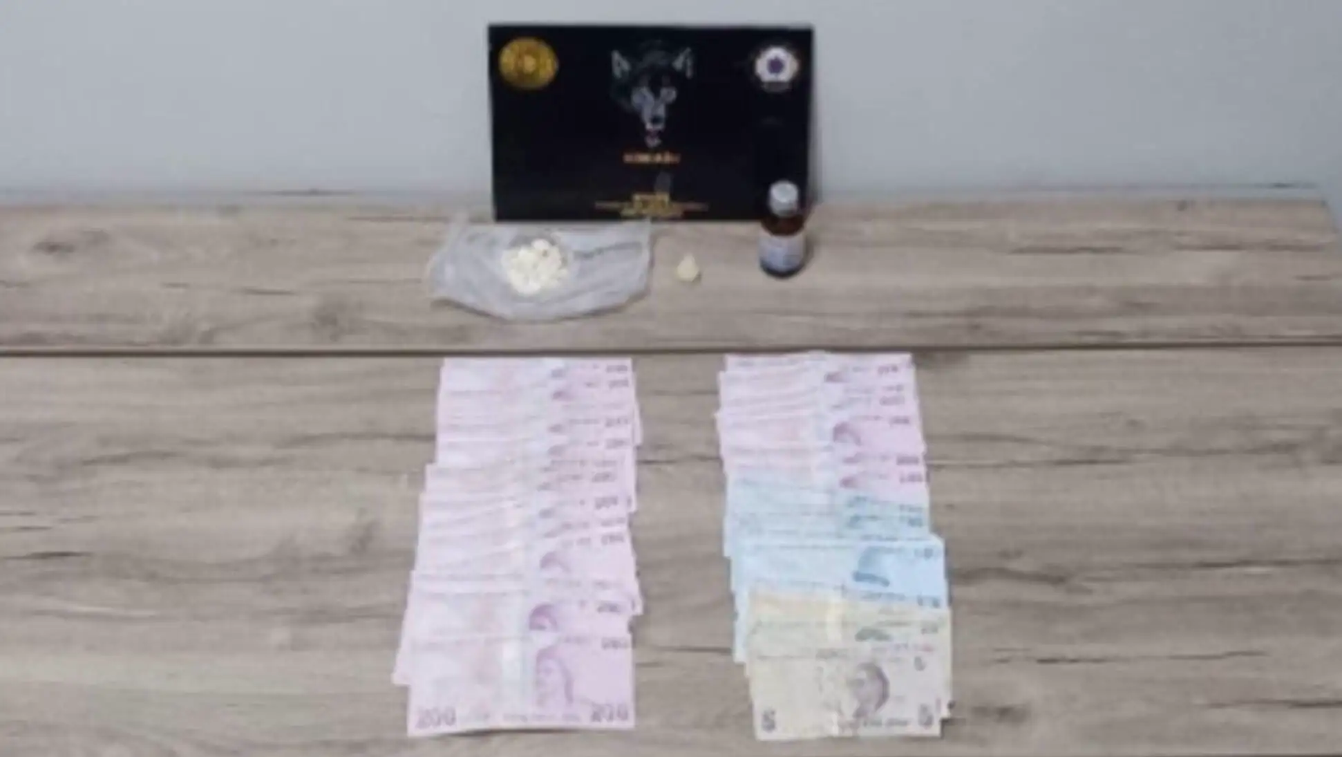 A table with drugs and money. A table with drugs and money.