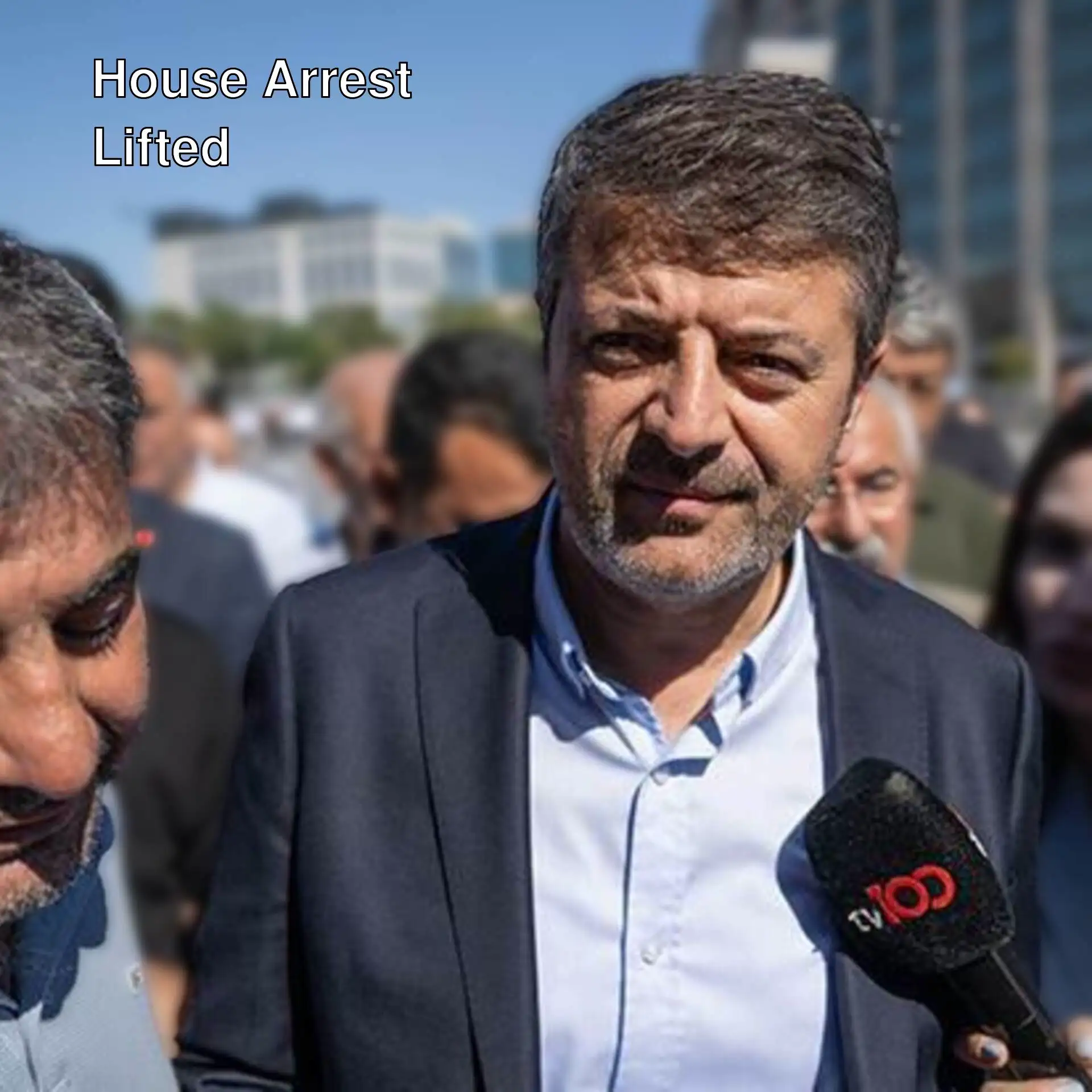 A man holding a microphone. A man holding a microphone.