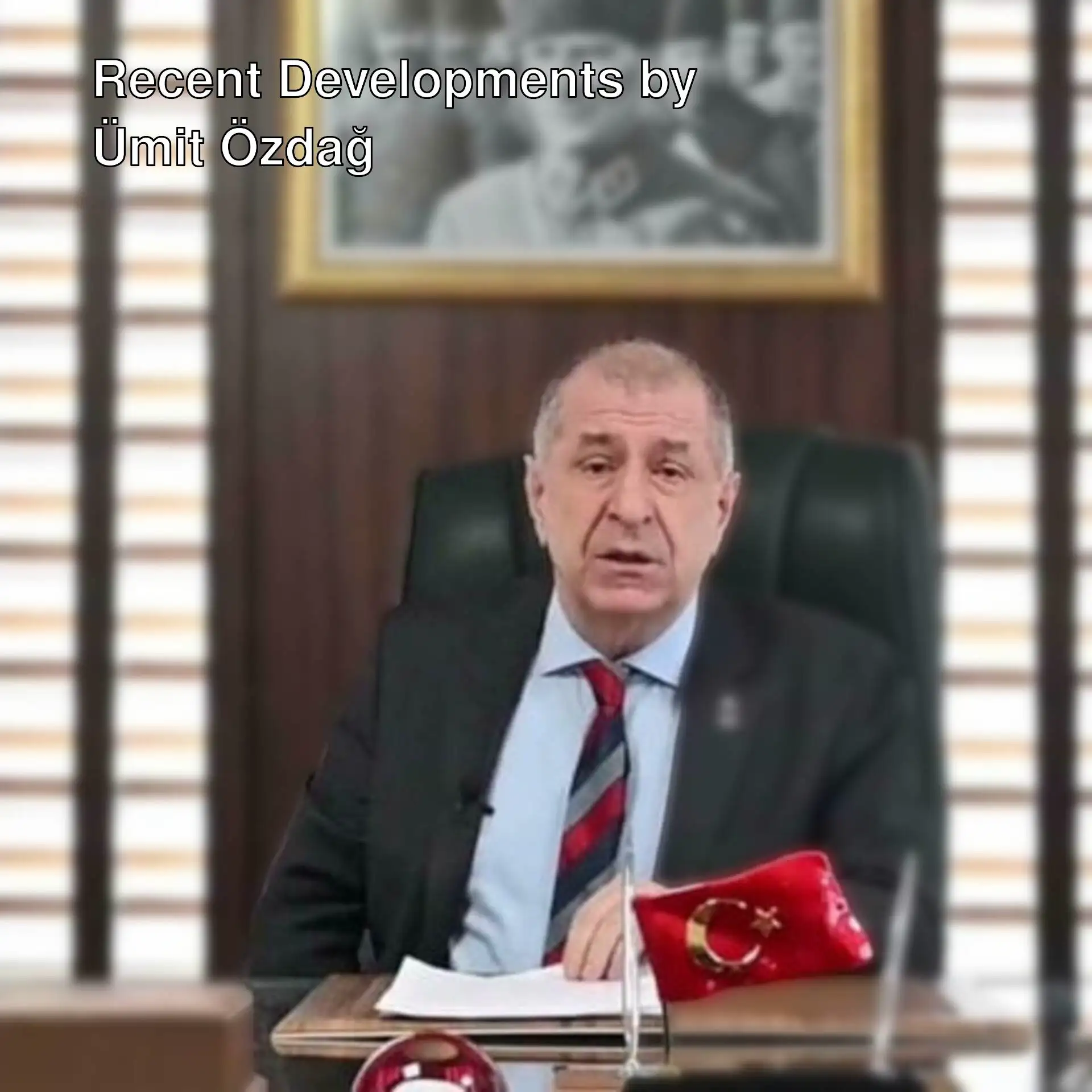 Ümit Özdağ sitting at a desk.
