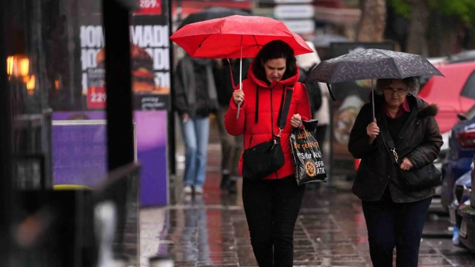 A woman walking in the rain.