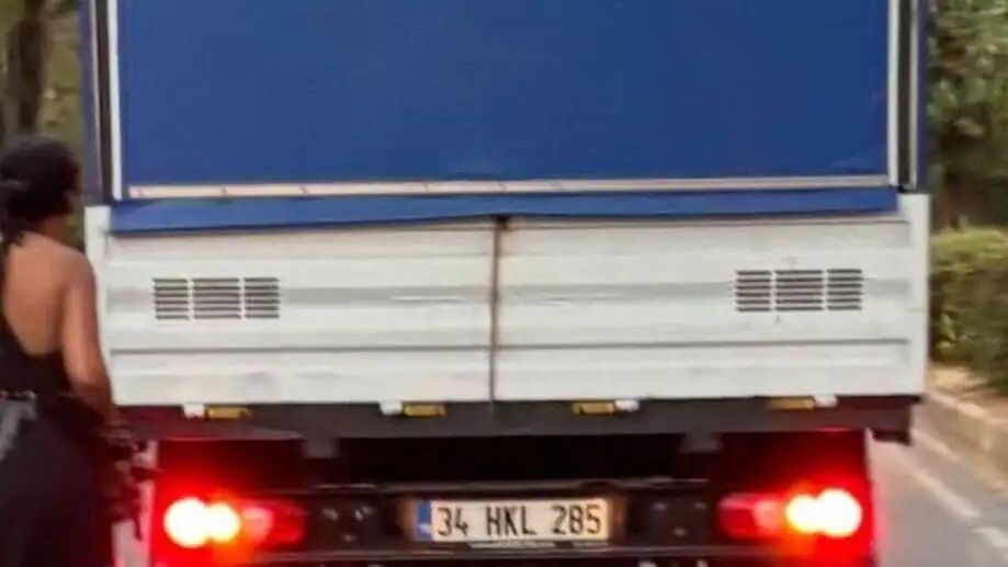 A back of a truck with red lights.