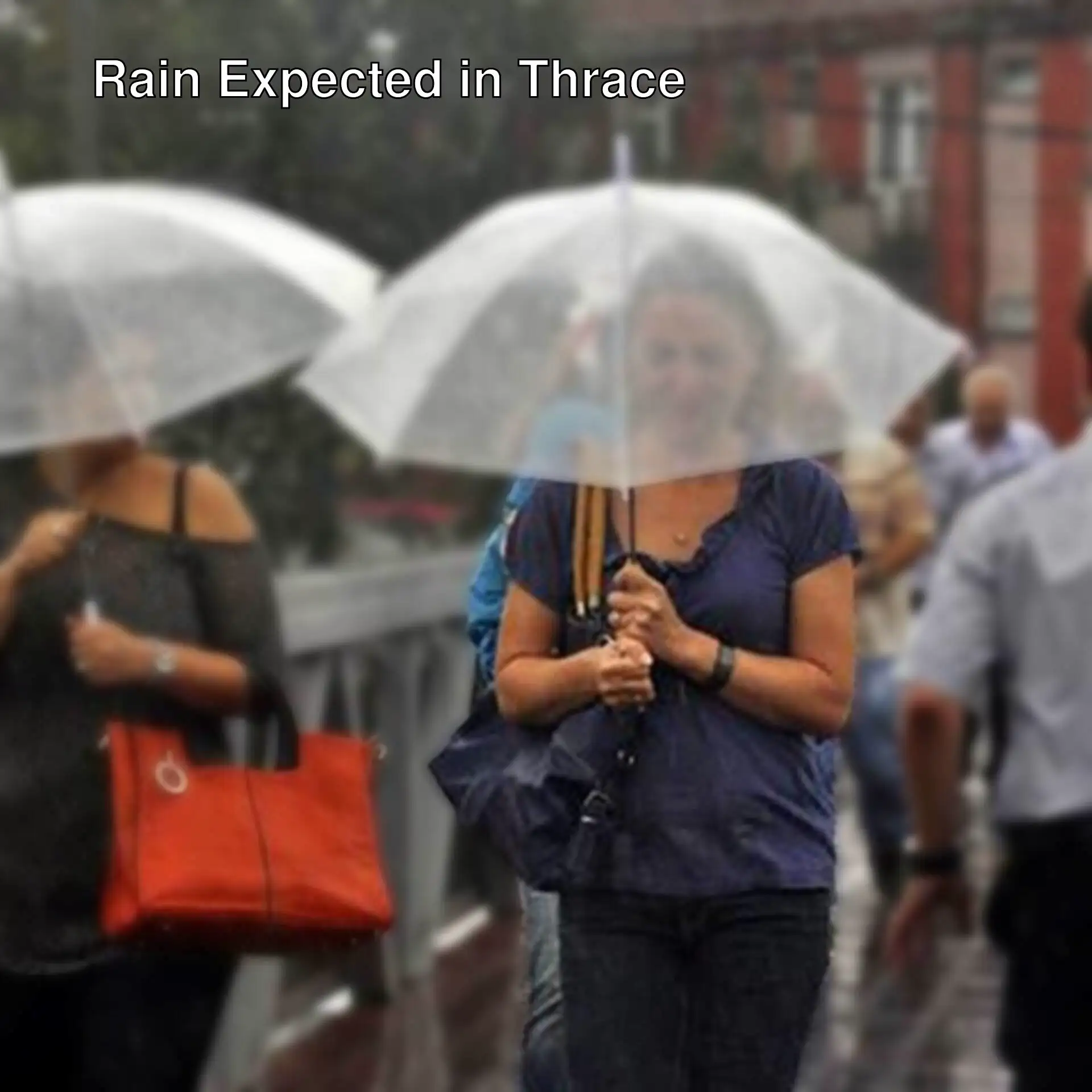 A group of people walking with umbrellas. A group of people walking with umbrellas.