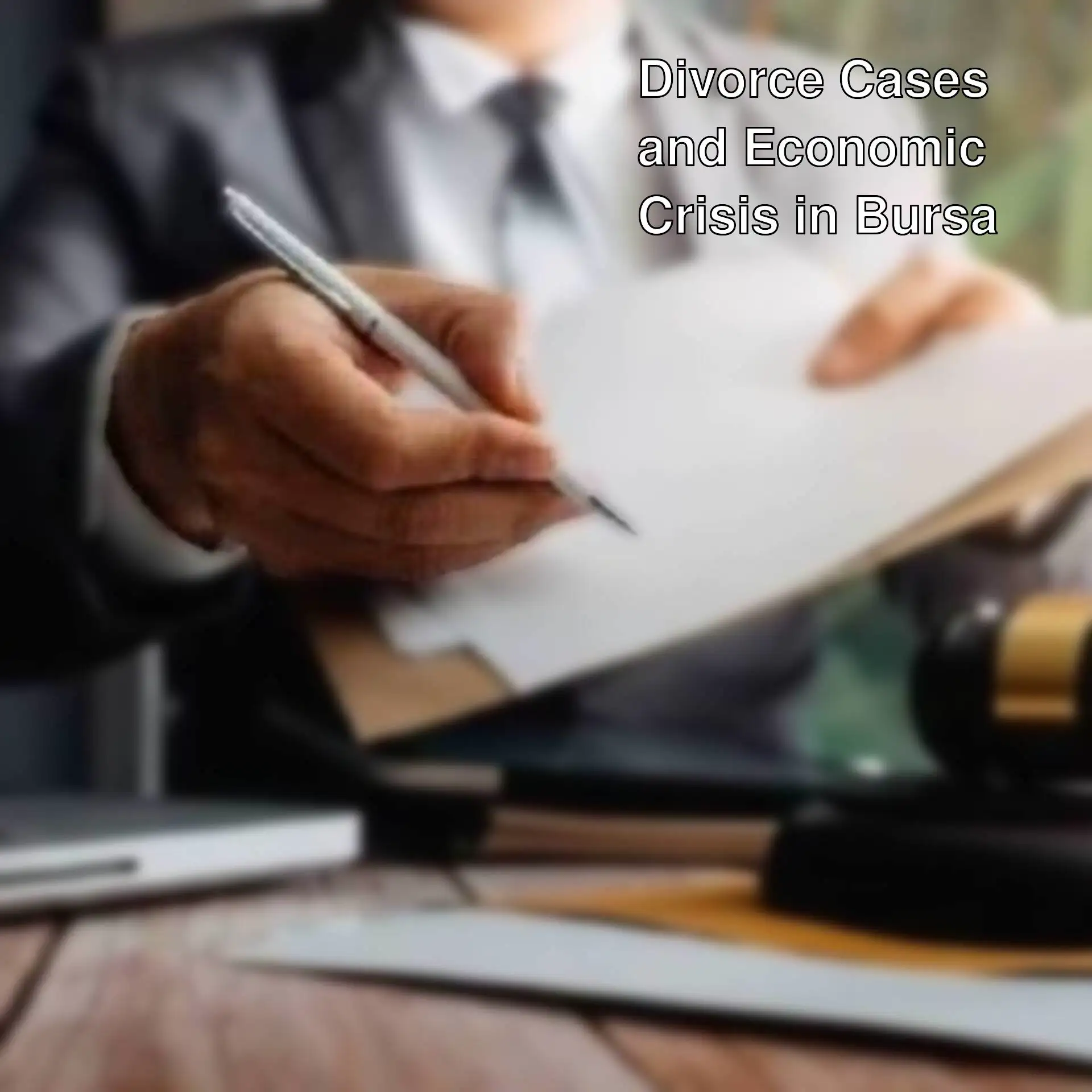 A person holding a pen and paper. A person holding a pen and paper.
