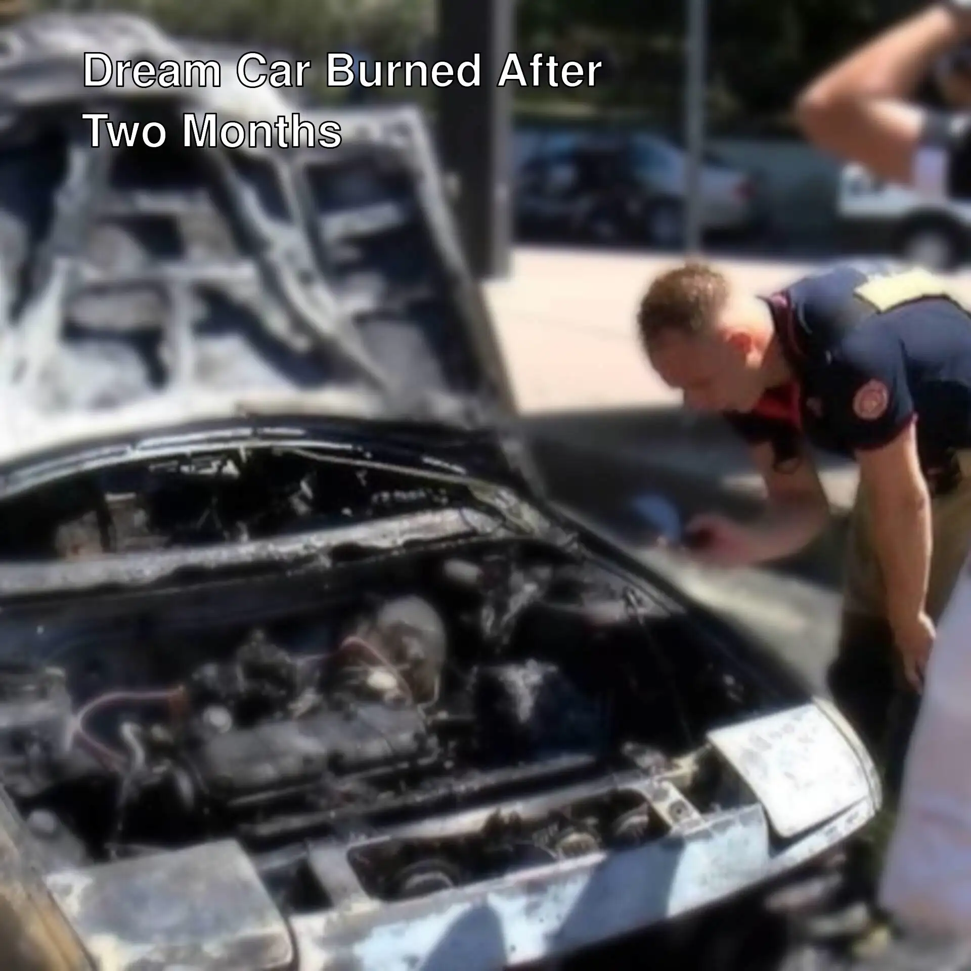 A group of men looking at a burnt car A group of men looking at a burnt car