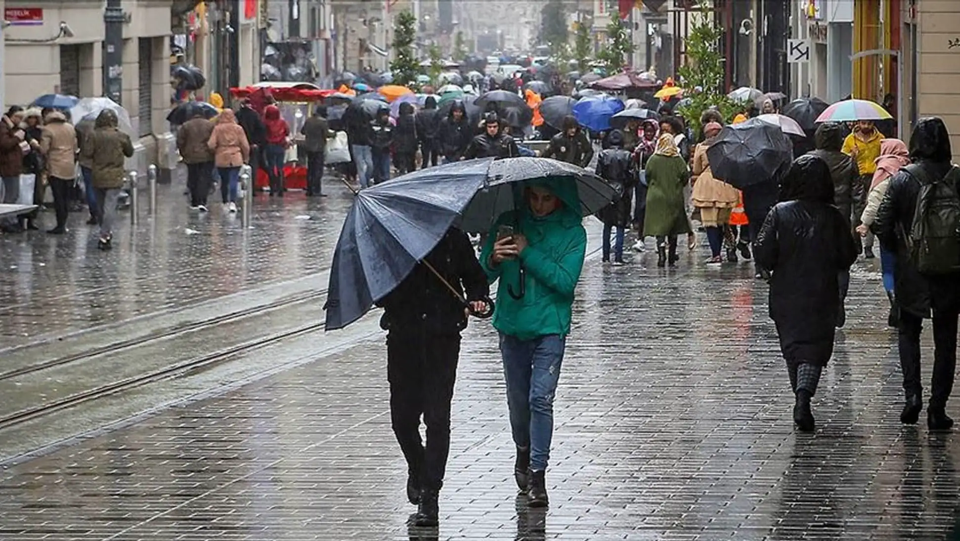 People walking with umbrellas