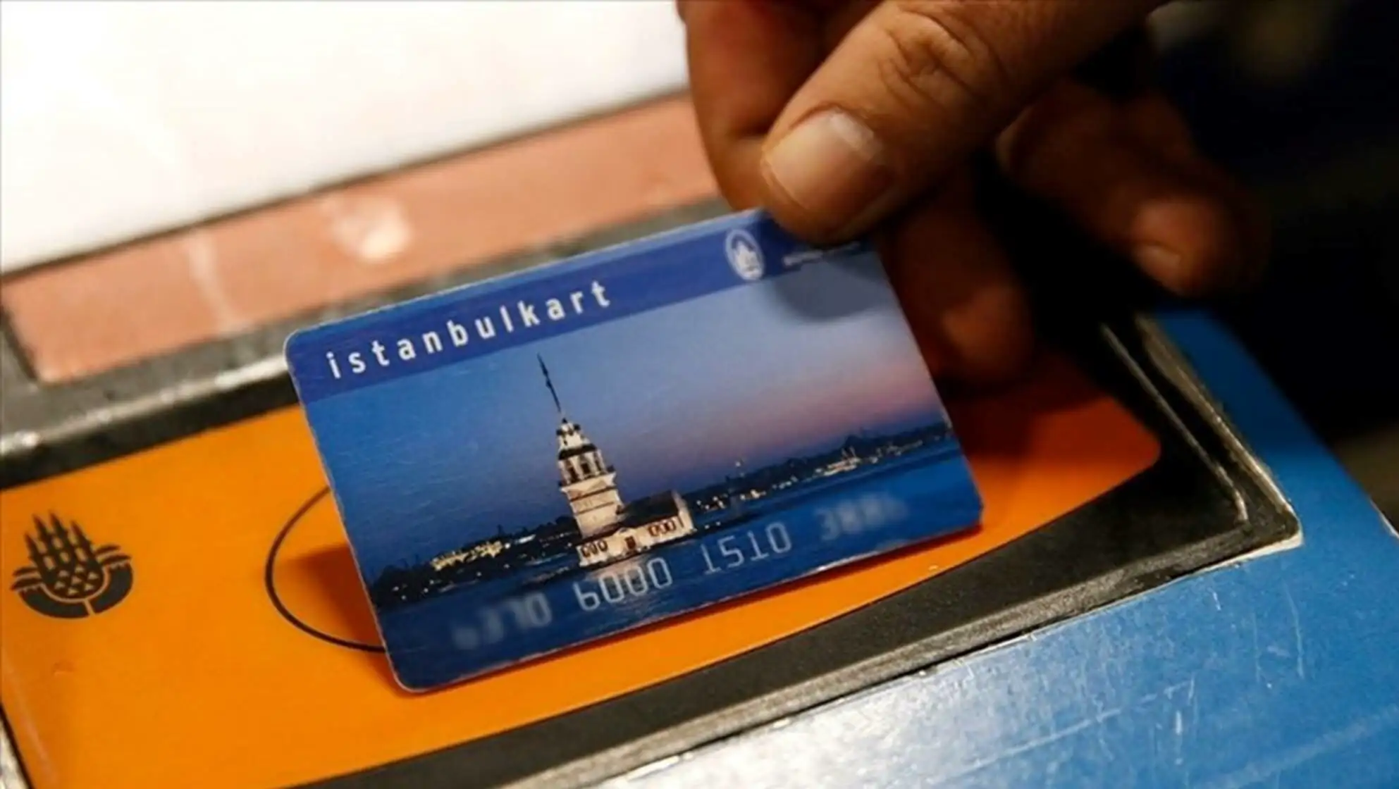 A person holding a credit card.