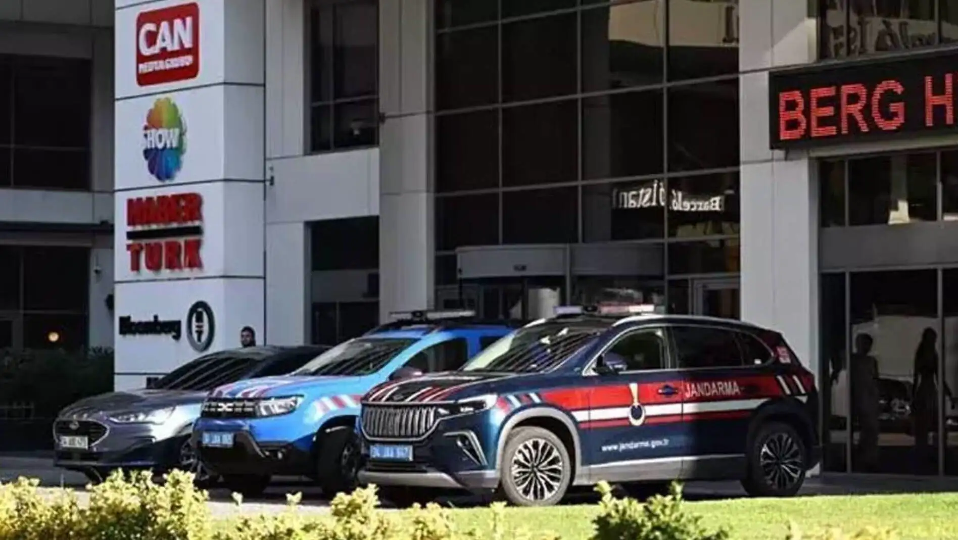 Cars parked in front of the Can Holding building. Cars parked in front of the Can Holding building.