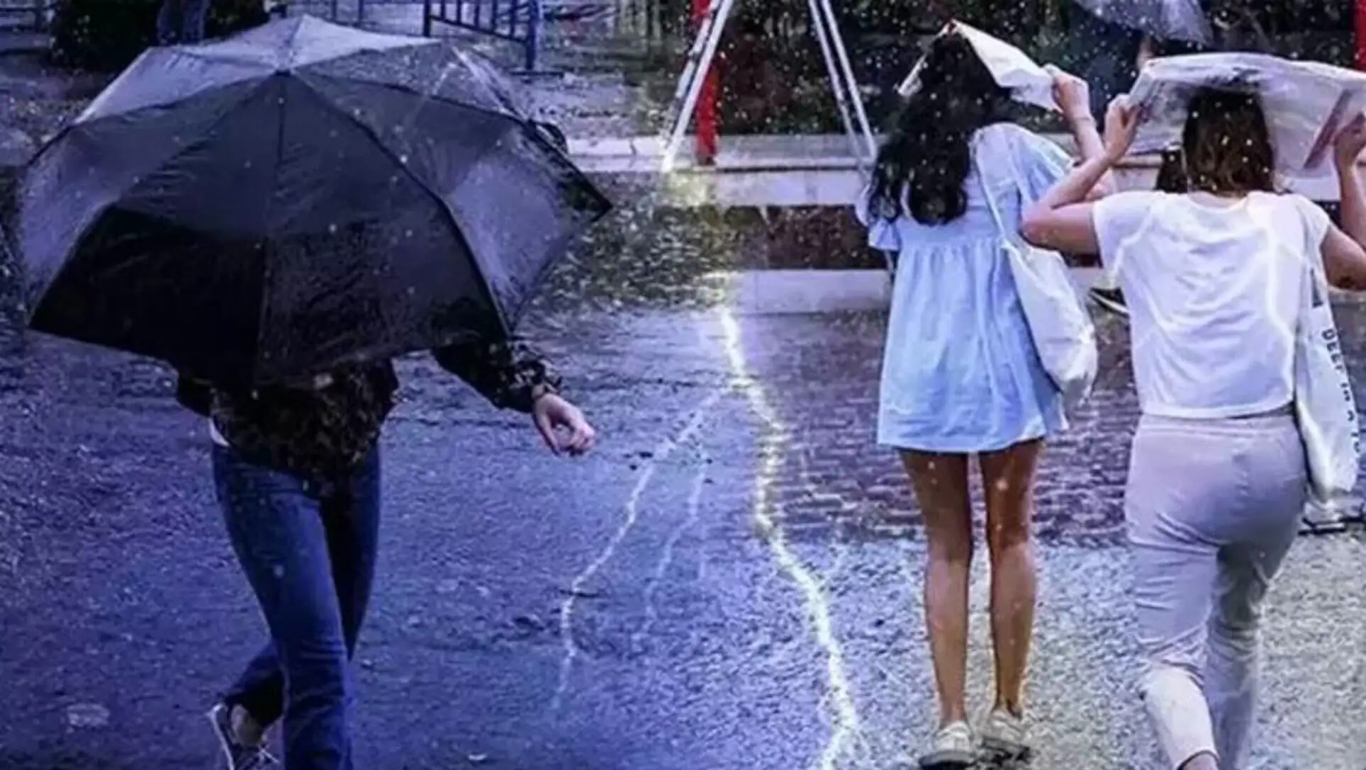 Yağmurda şemsiye ile yürüyen bir adam ve kadın.
