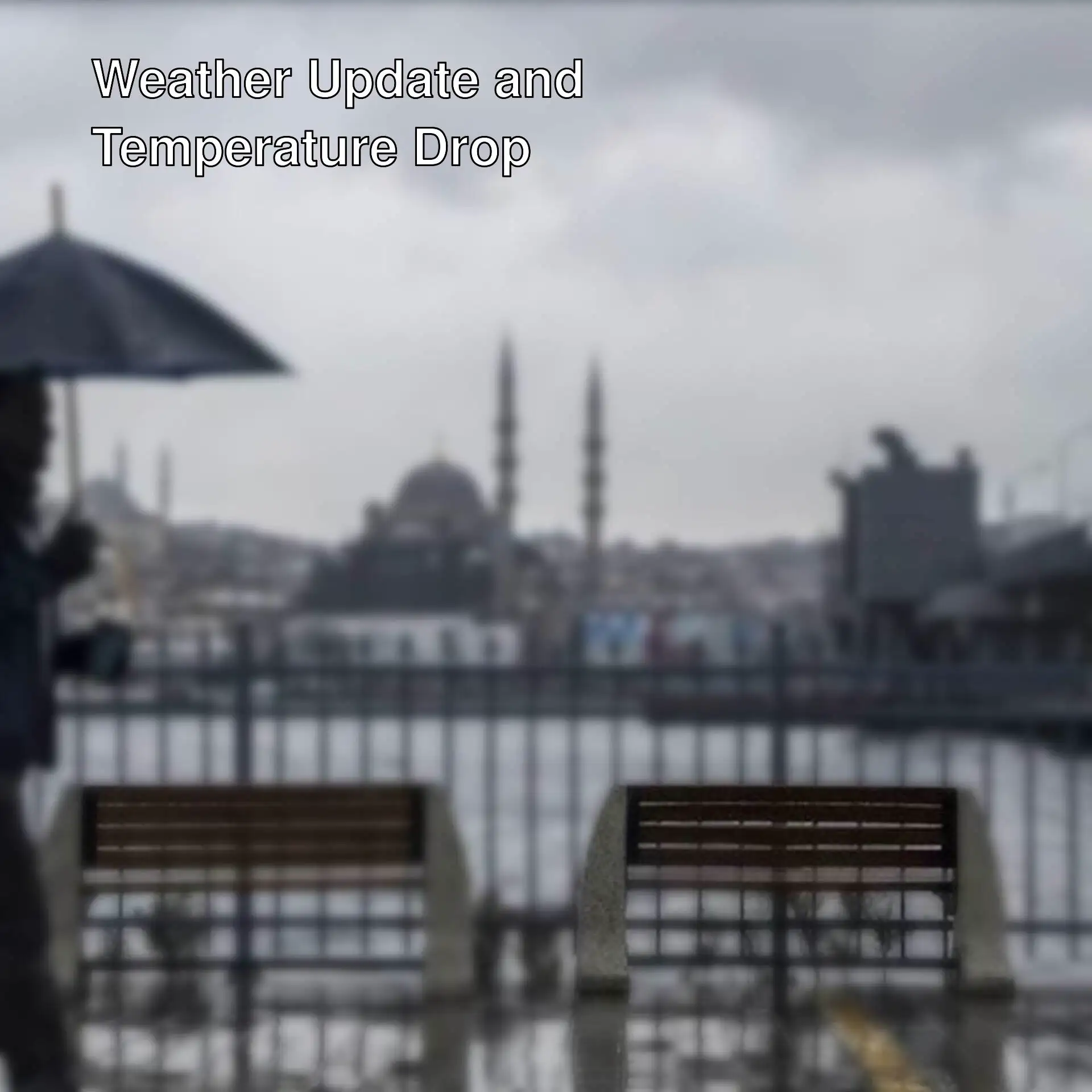 A man holding an umbrella in the rain.