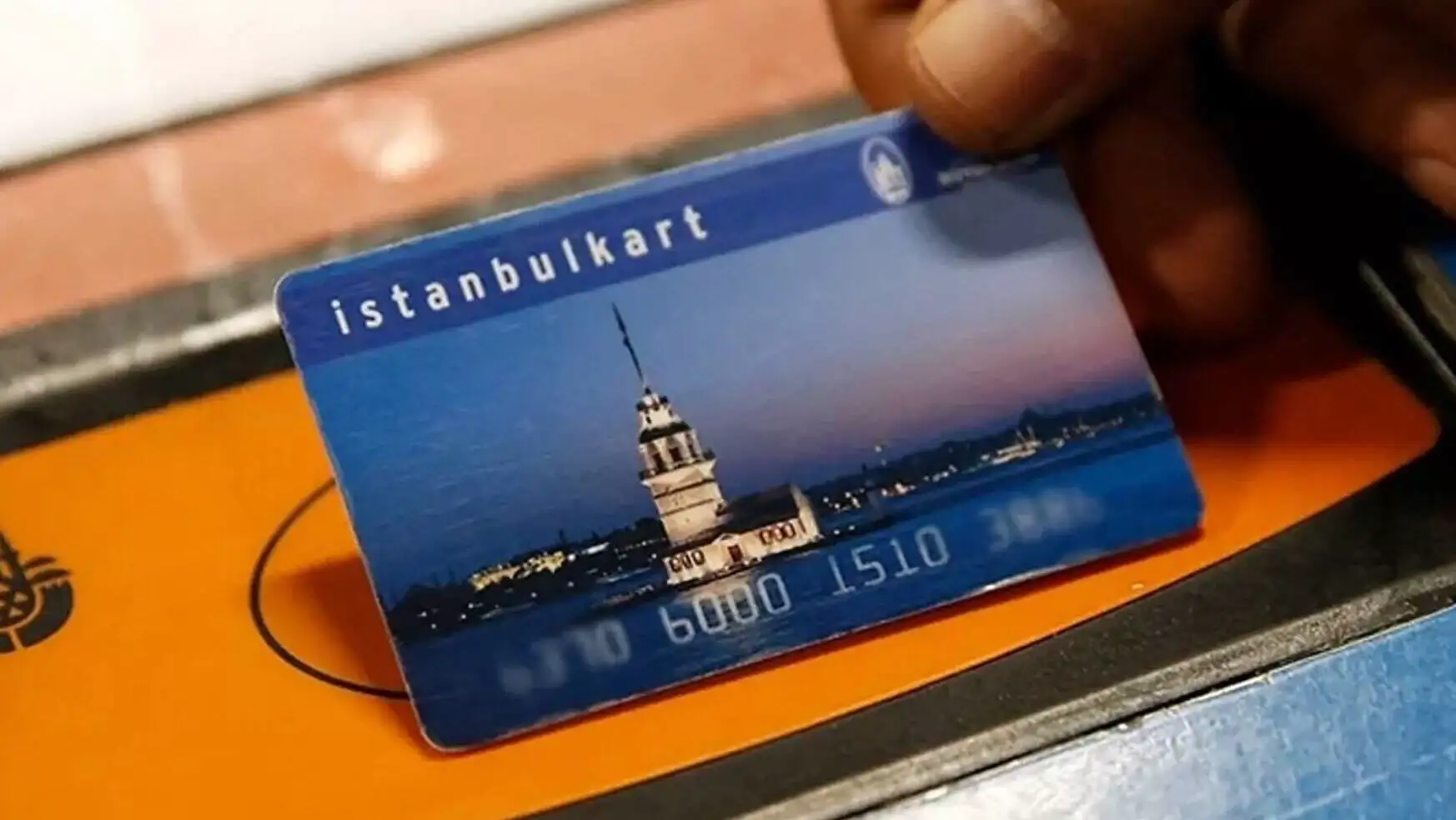 A person holding a credit card.