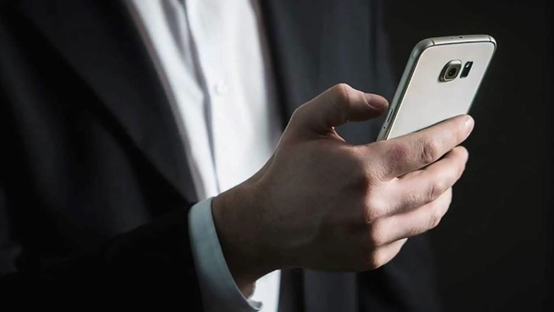 A person holding a cell phone.