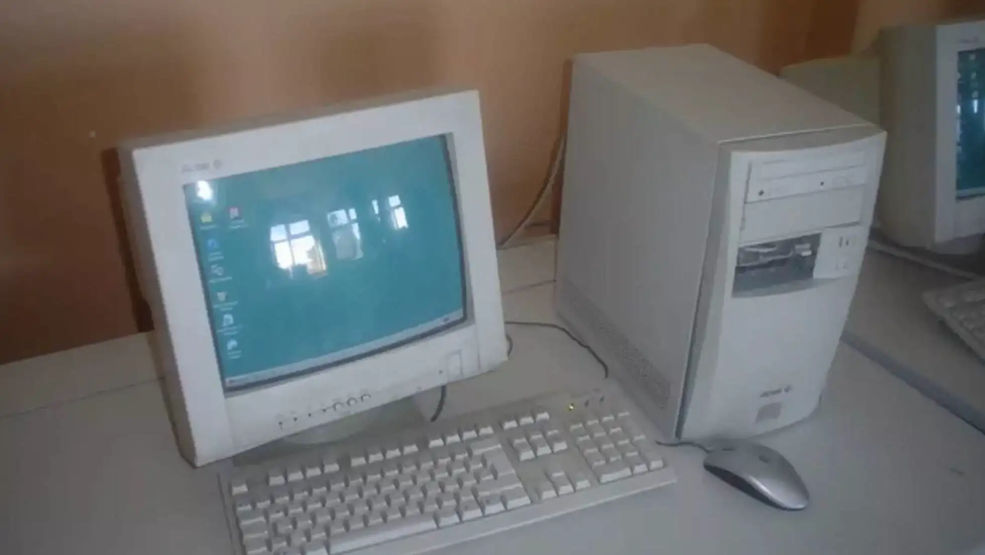 A computer on a table. A computer on a table.