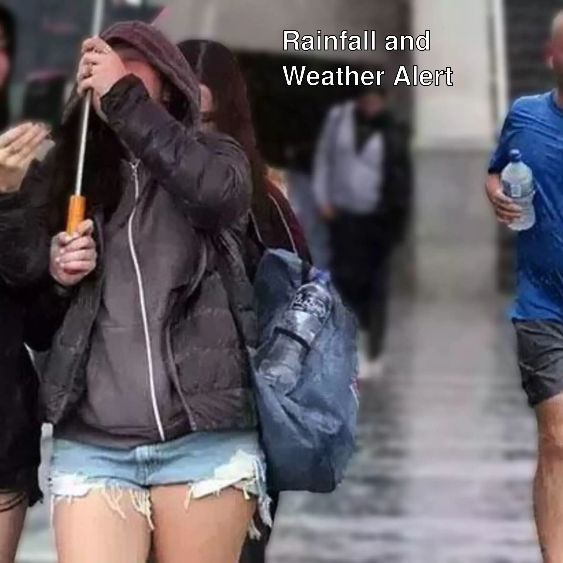 A group of people walking in the rain in Istanbul.
