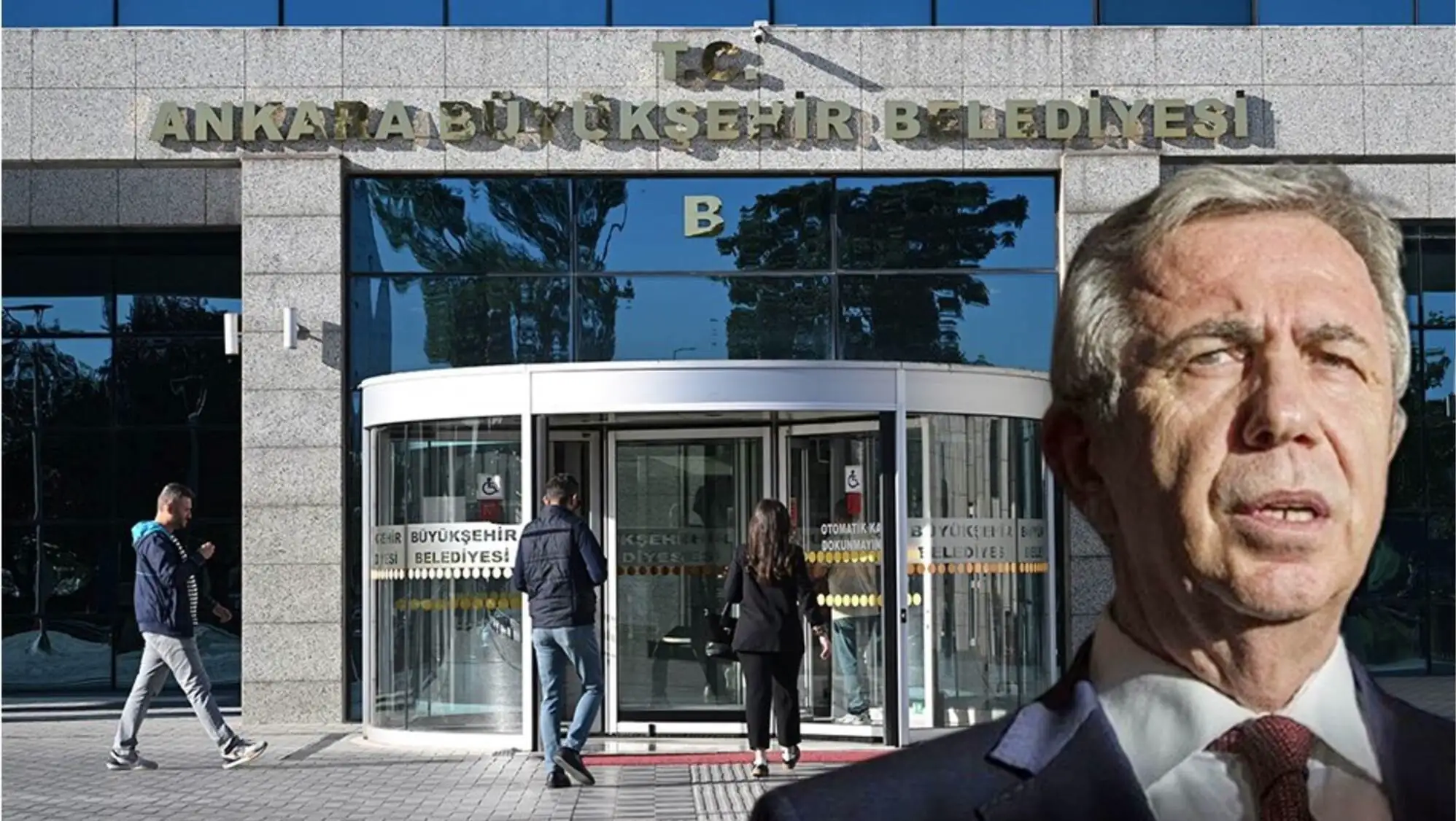 Mansur Yavaş, bir binanın önünde duruyor.