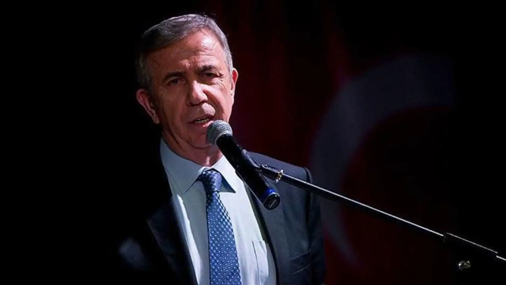 Mansur Yavaş speaking into a microphone.