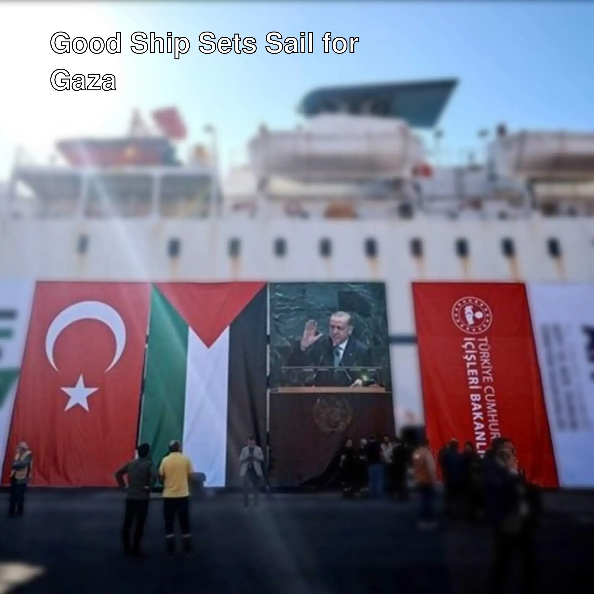 A large white ship with flags on it.