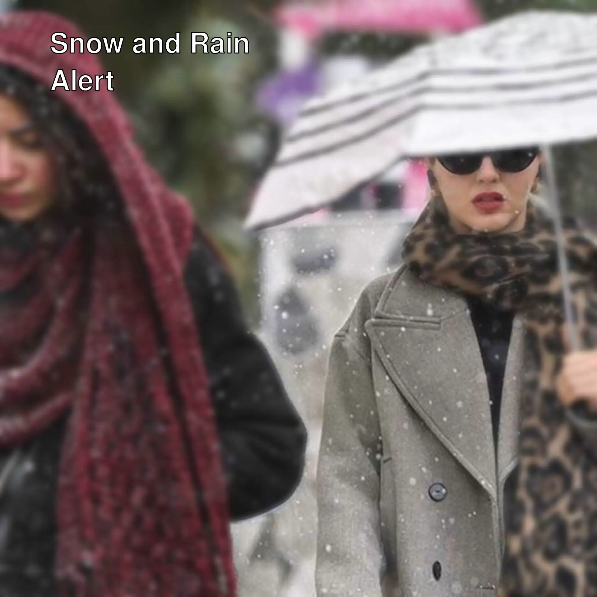 Two women walking under an umbrella.