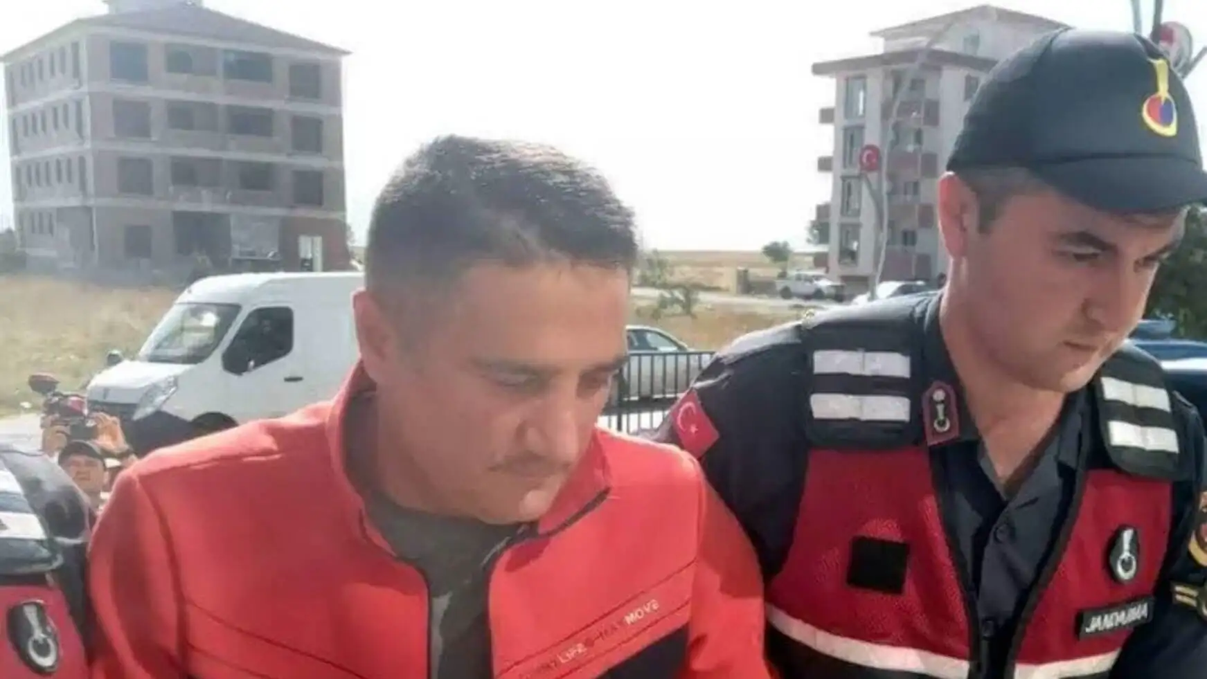 A man in uniform with another man in uniform. A man in uniform with another man in uniform.
