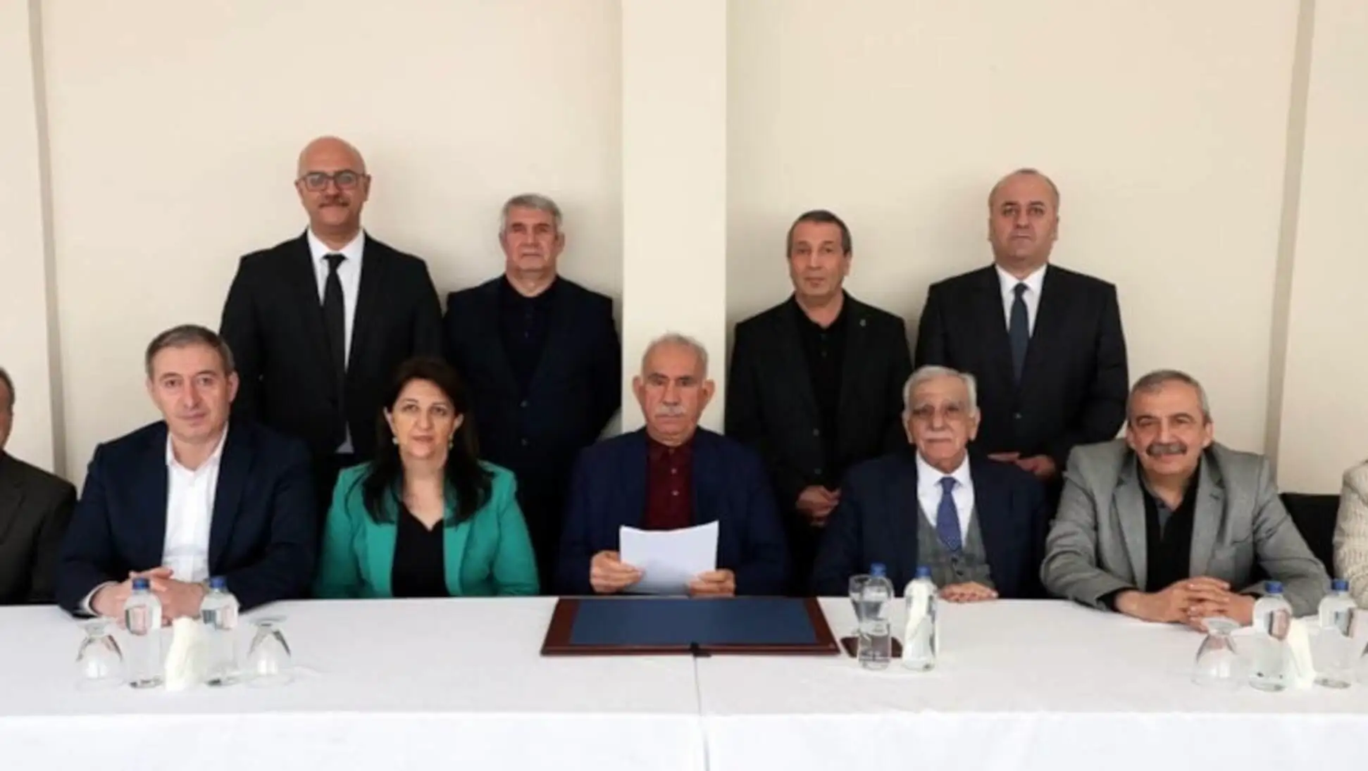 A group of people sitting at a table. A group of people sitting at a table.