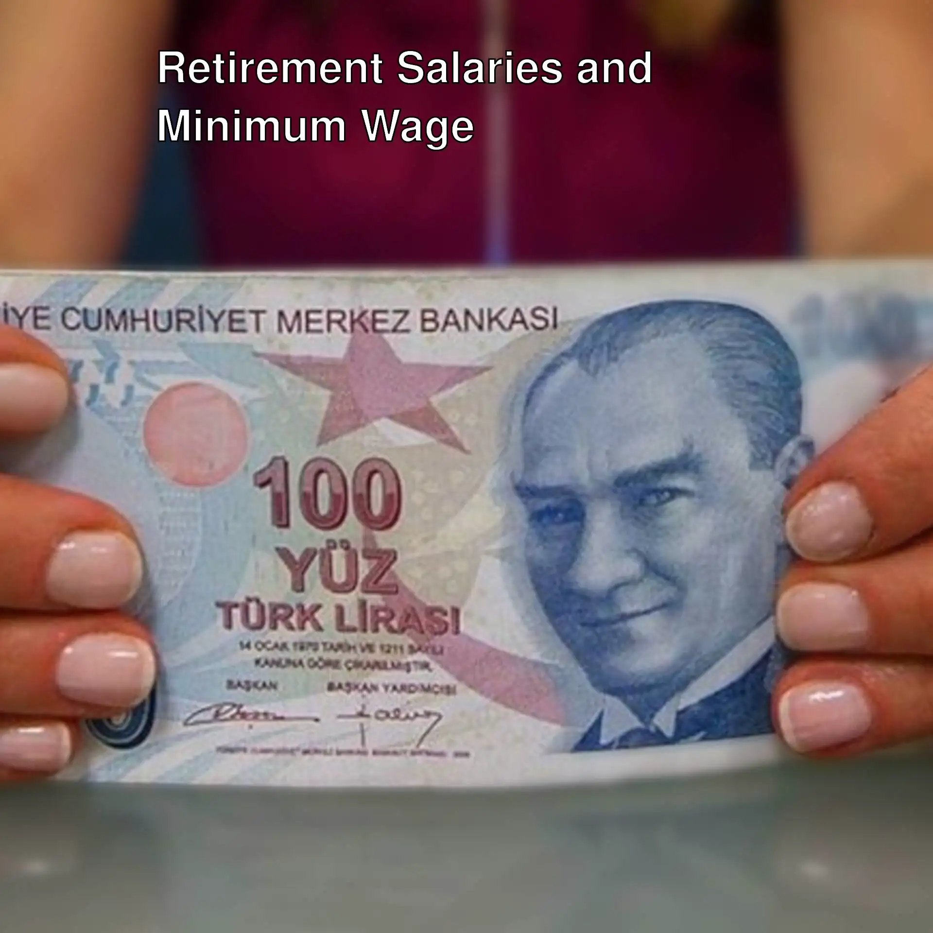 A person holding currency. A person holding currency.