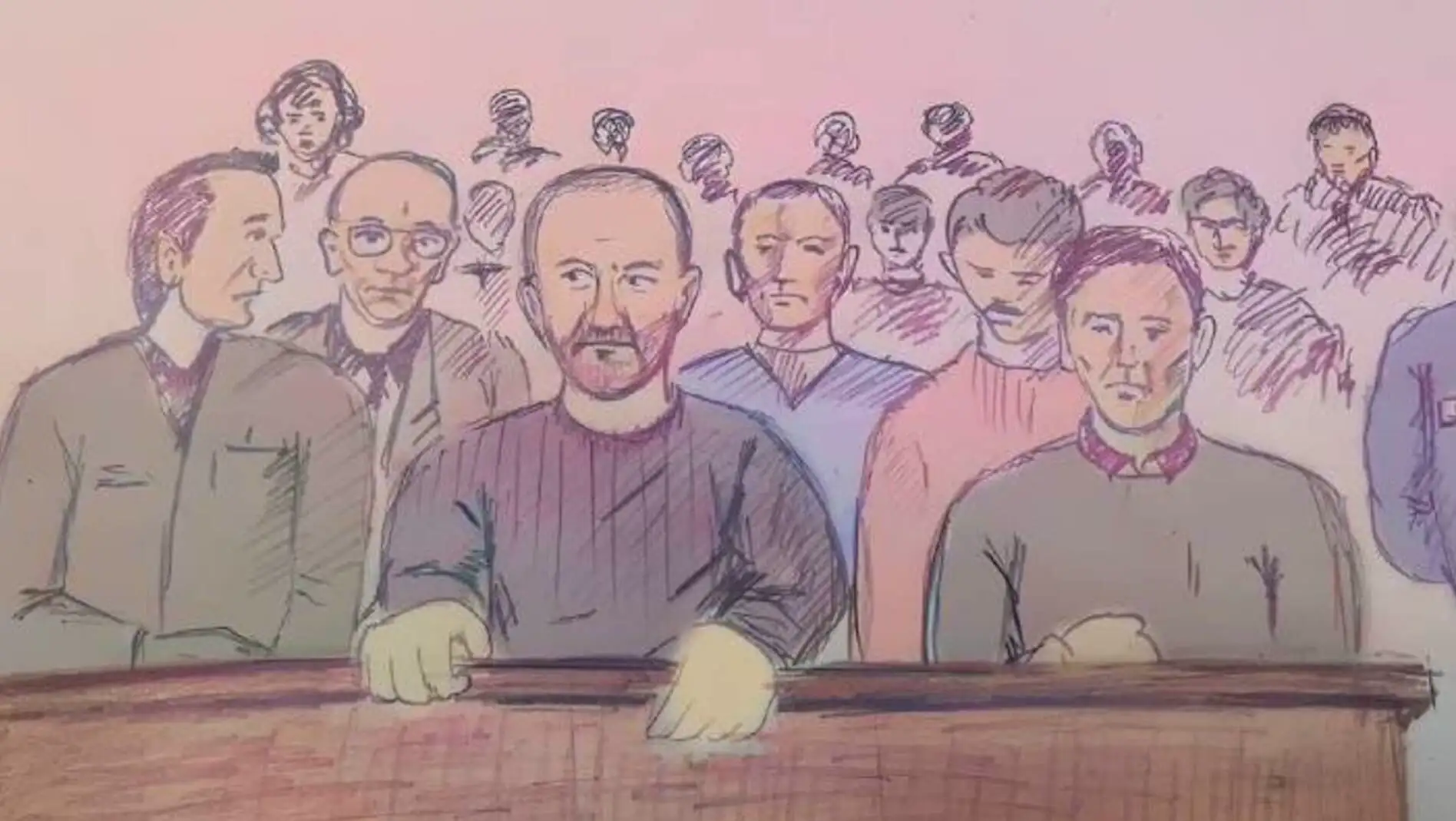 A group of men sitting around a table. A group of men sitting around a table.