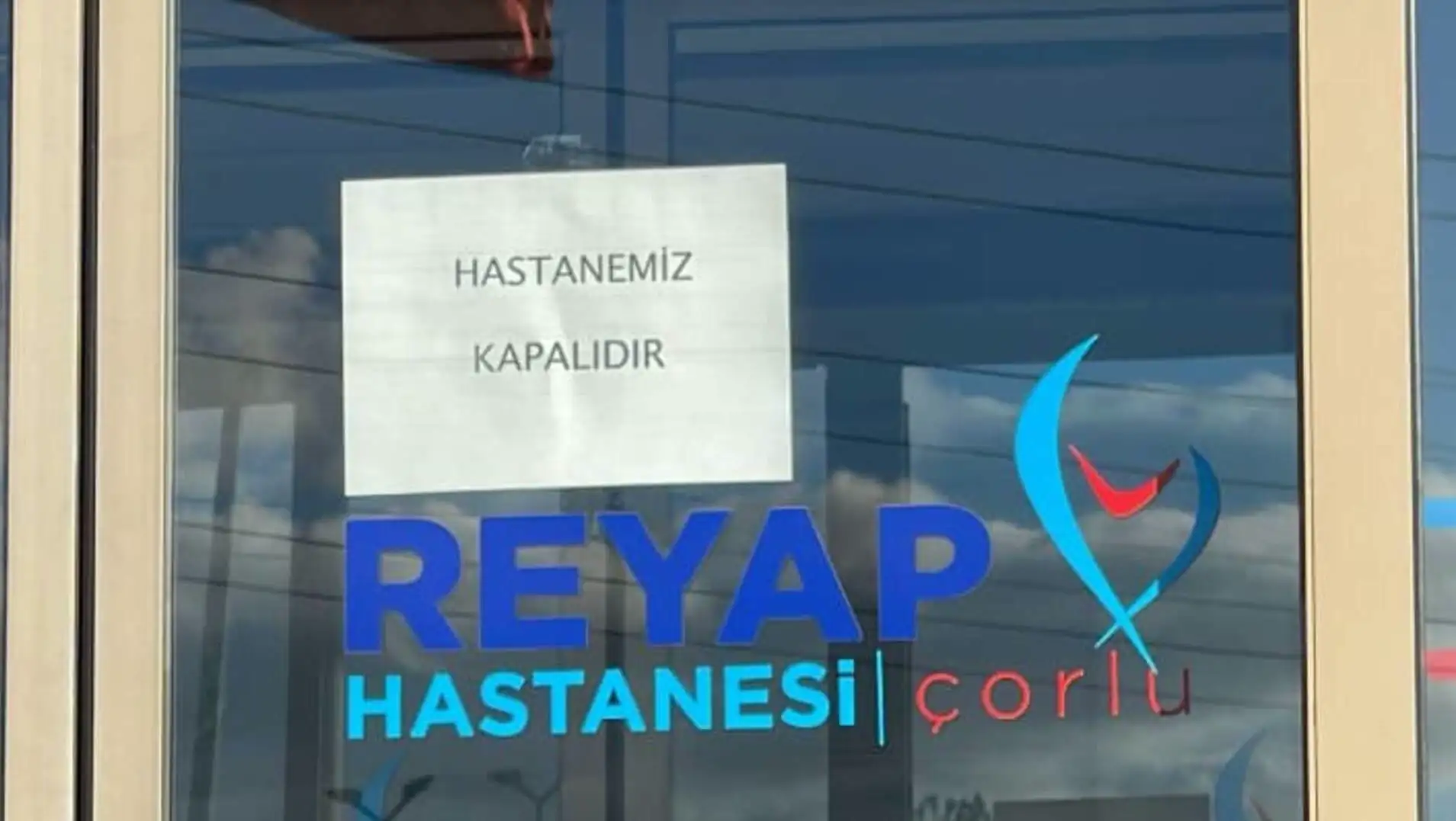 A sign on a window. A sign on a window.