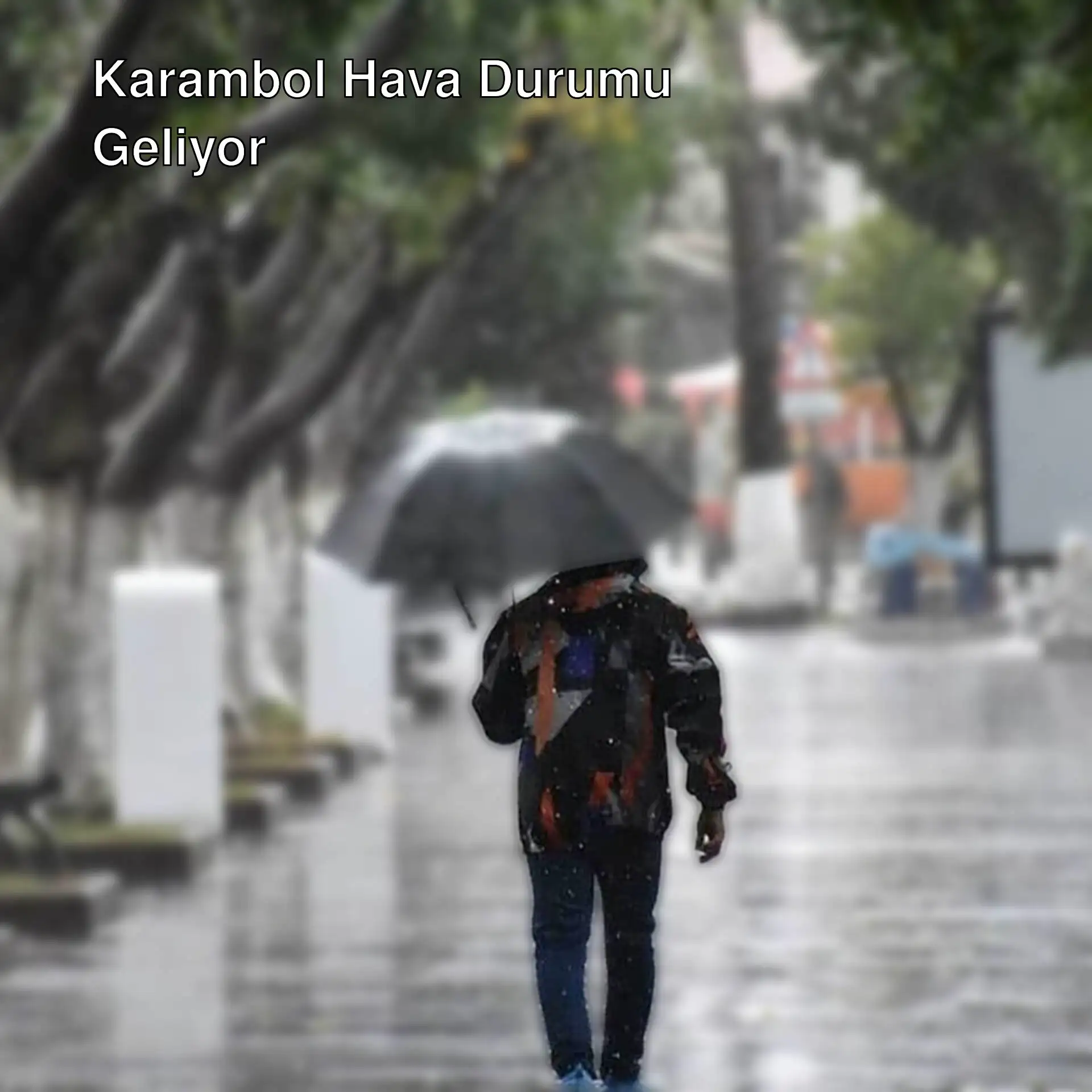 Yağmurda şemsiye ile yürüyen bir kişi. Yağmurda şemsiye ile yürüyen bir kişi.