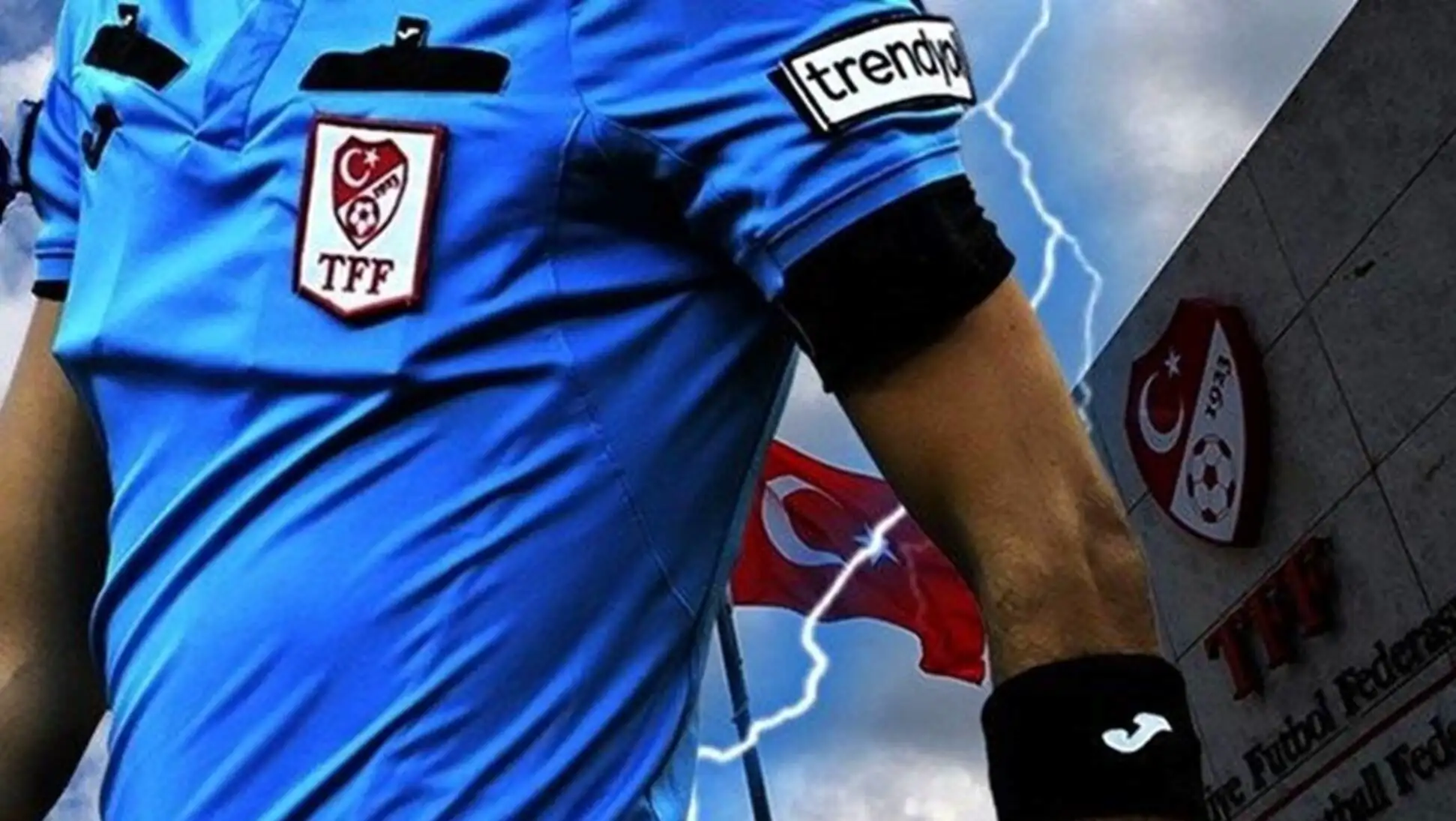 A football referee pointing at something. A football referee pointing at something.