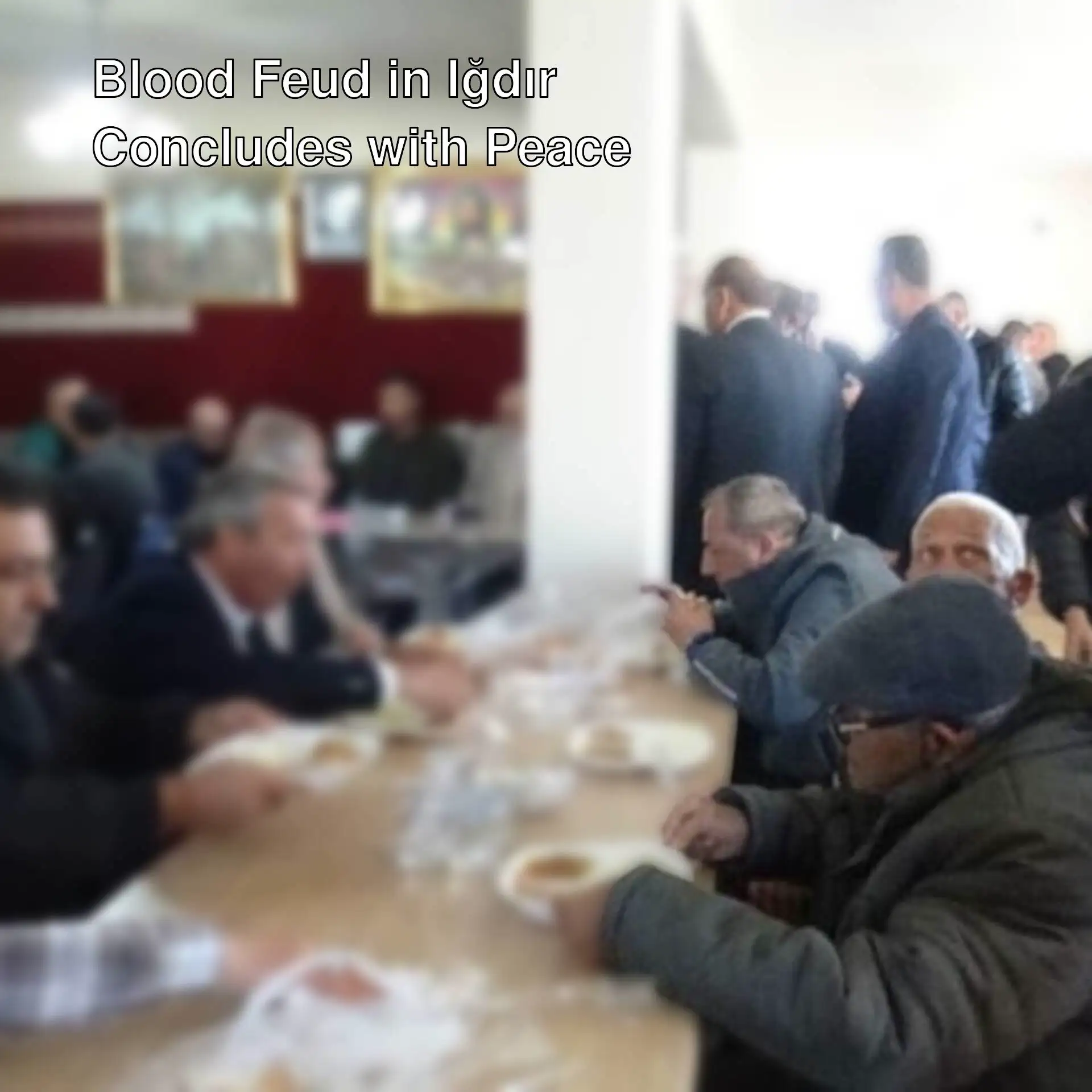 A group of people eating at a table. A group of people eating at a table.