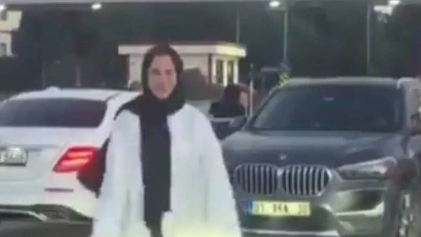 A woman standing on a car. A woman standing on a car.