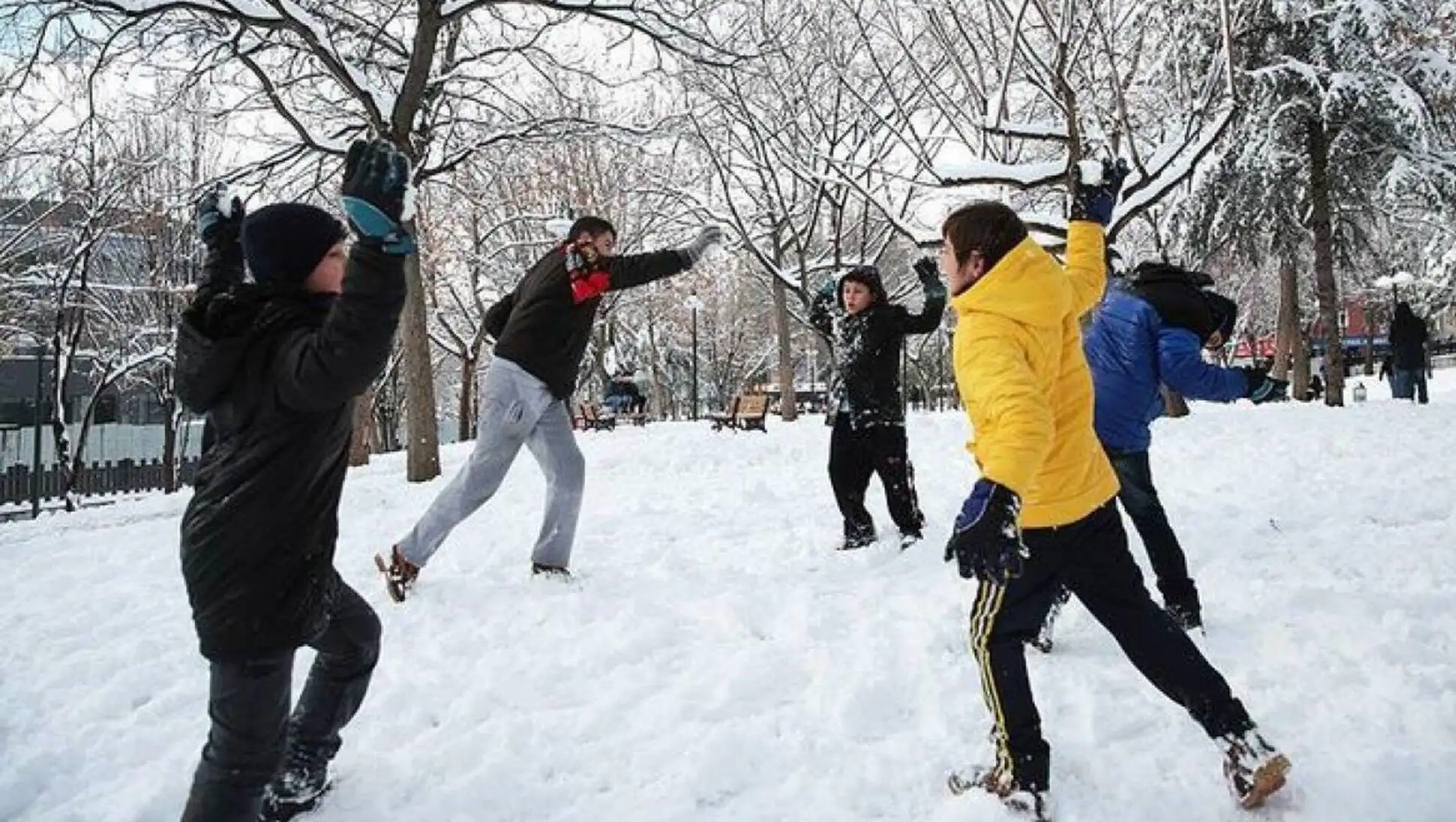 Children playing snowballs in the snow, showcasing winter activities during school closures. Children playing snowballs in the snow, showcasing winter activities during school closures.