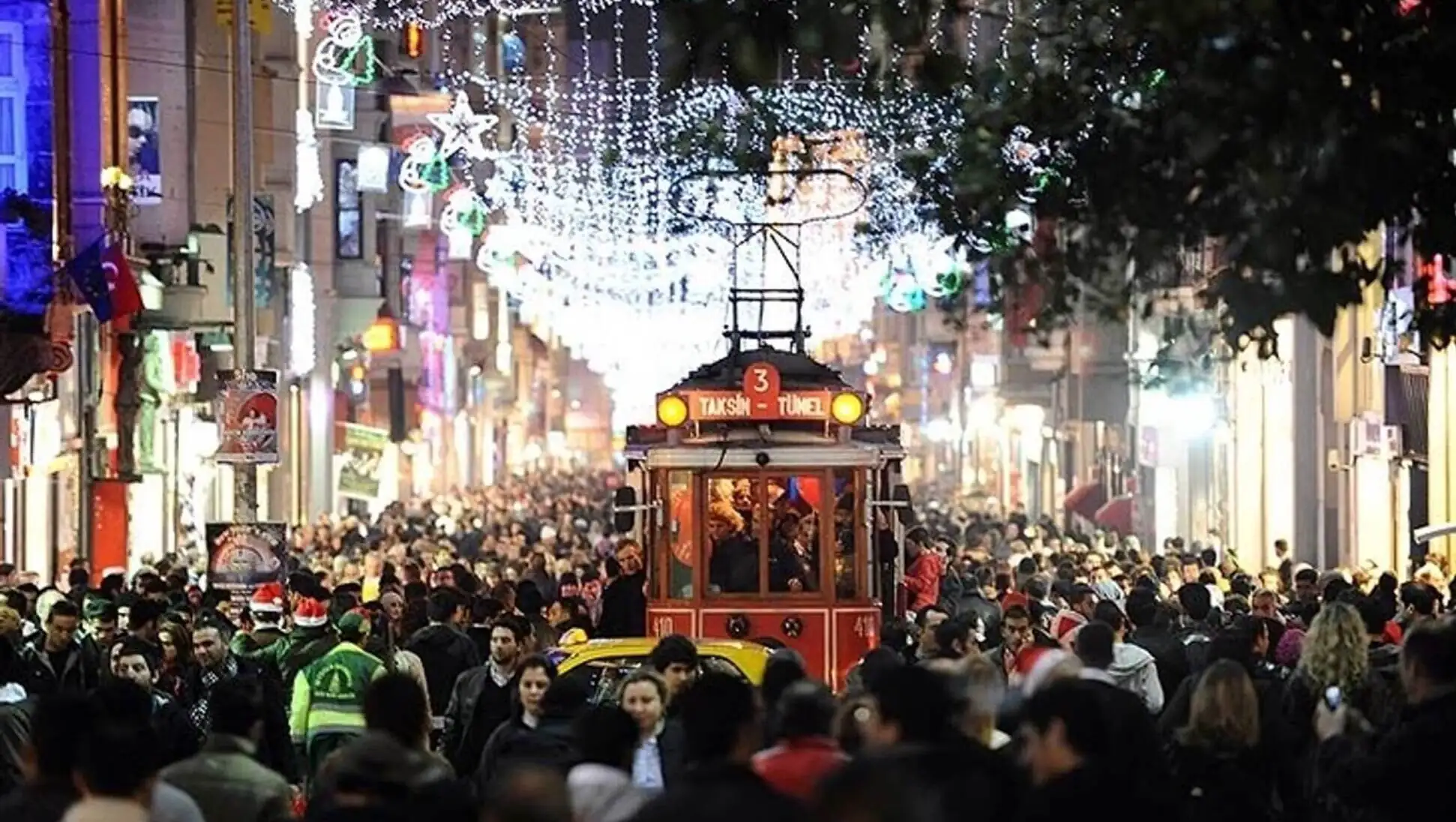 A crowded street with a trolley in Istanbul. A crowded street with a trolley in Istanbul.