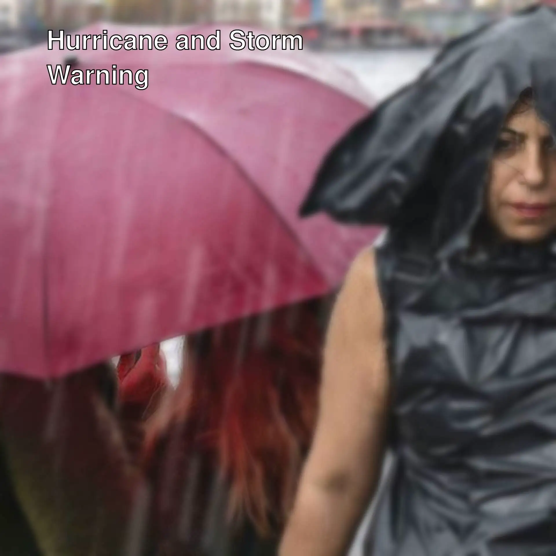 A woman holding an umbrella in the rain.