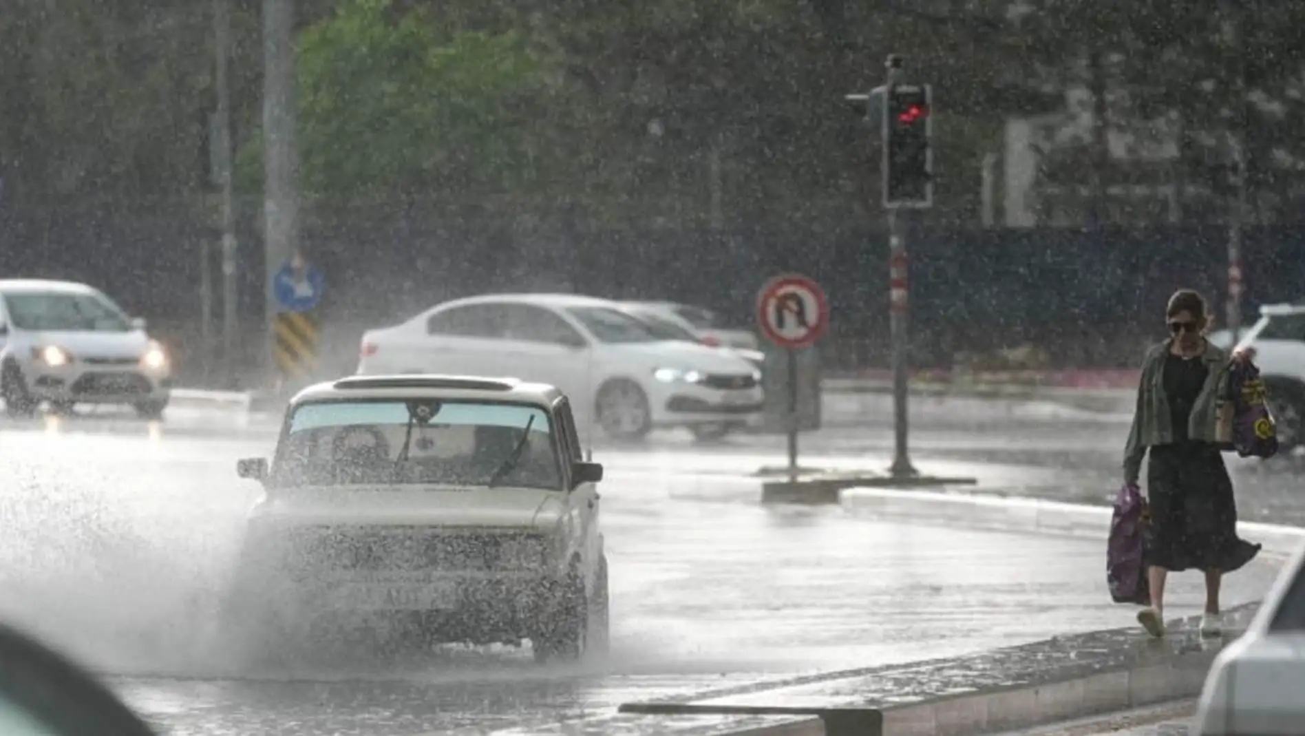 Cars driving on a wet road. Cars driving on a wet road.