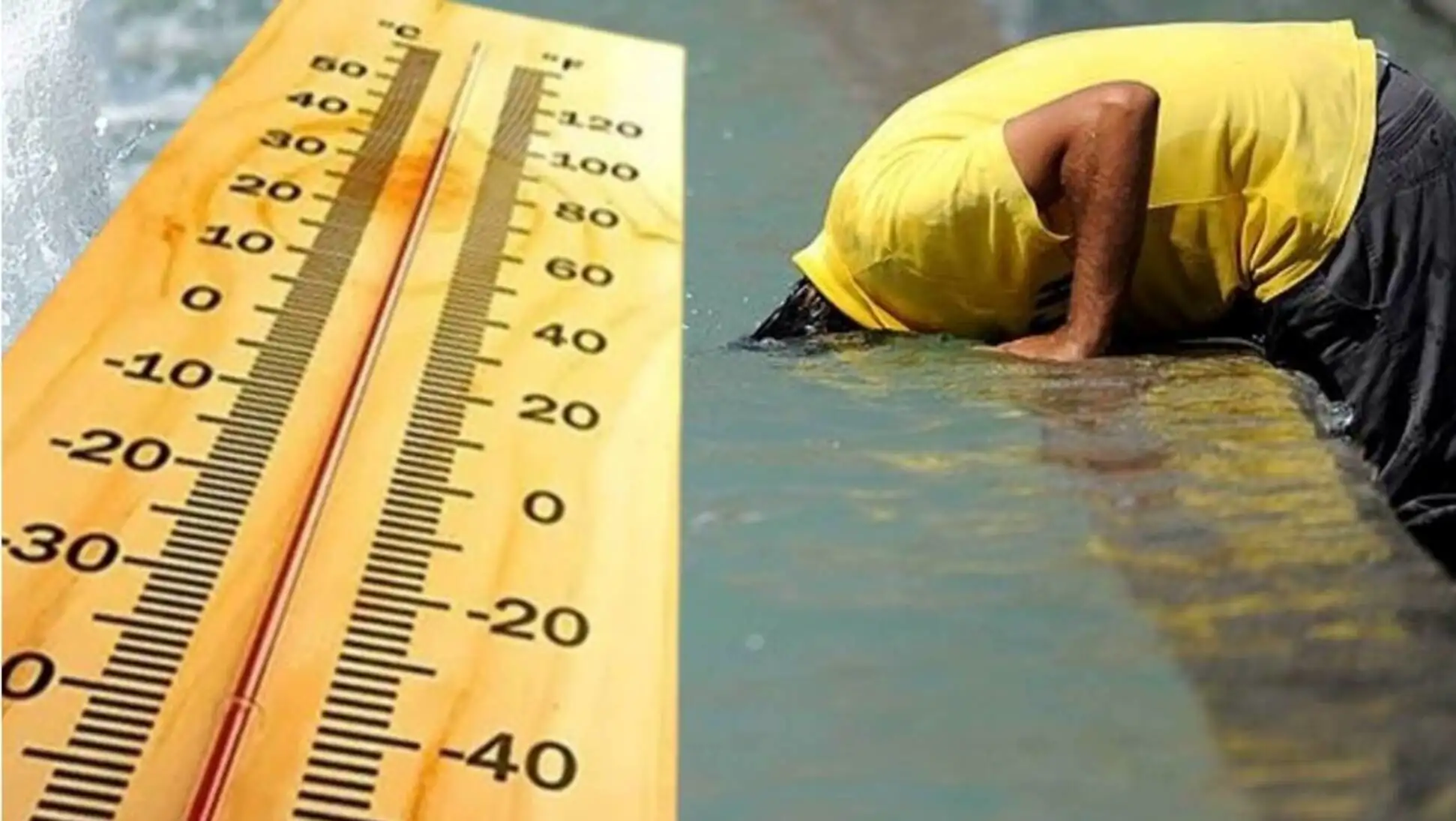 A man in a yellow shirt in water with a large thermometer.