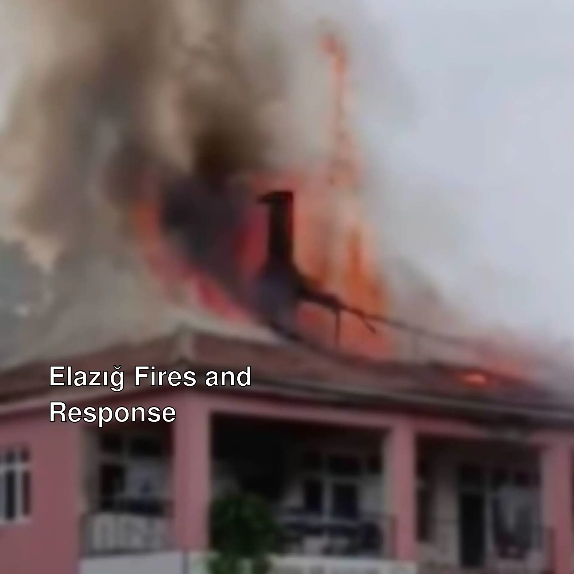 A building on fire with smoke and flames