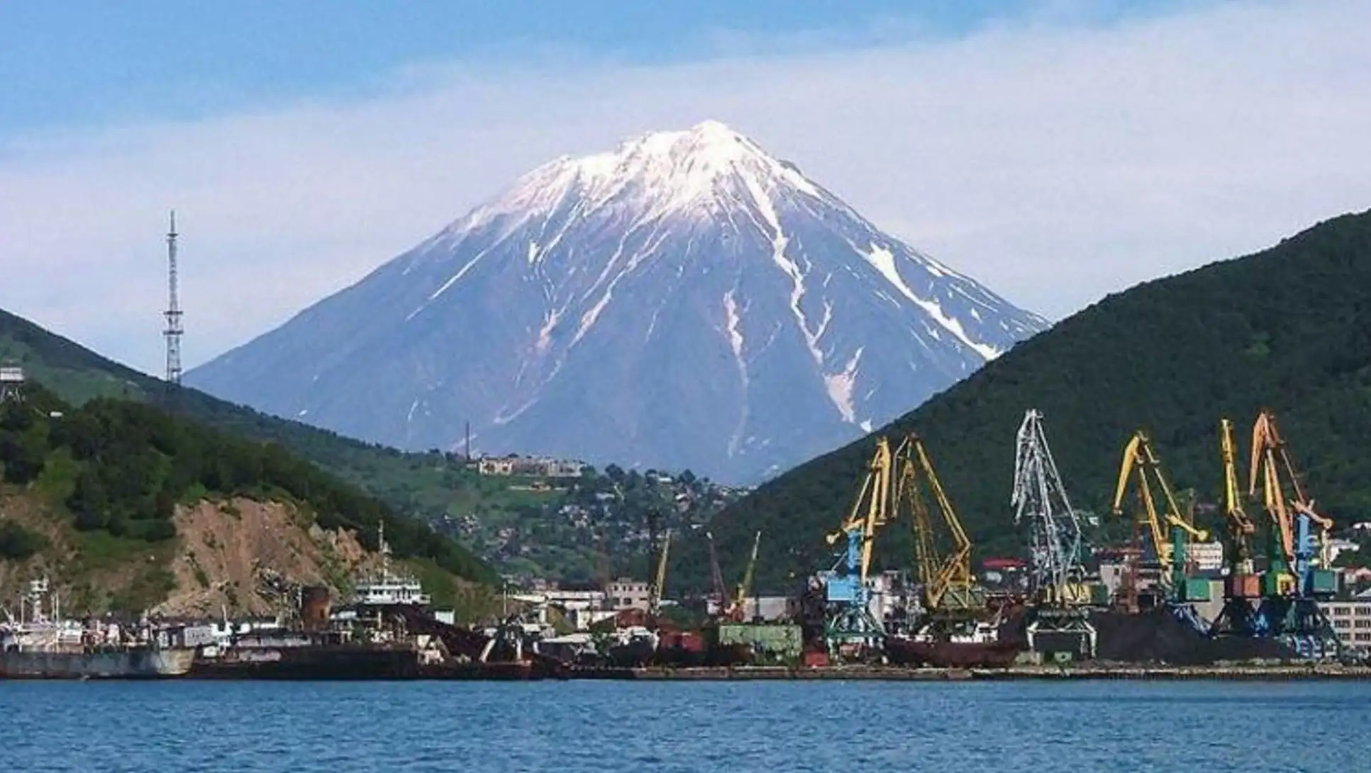A mountain with a snowy peak. A mountain with a snowy peak.