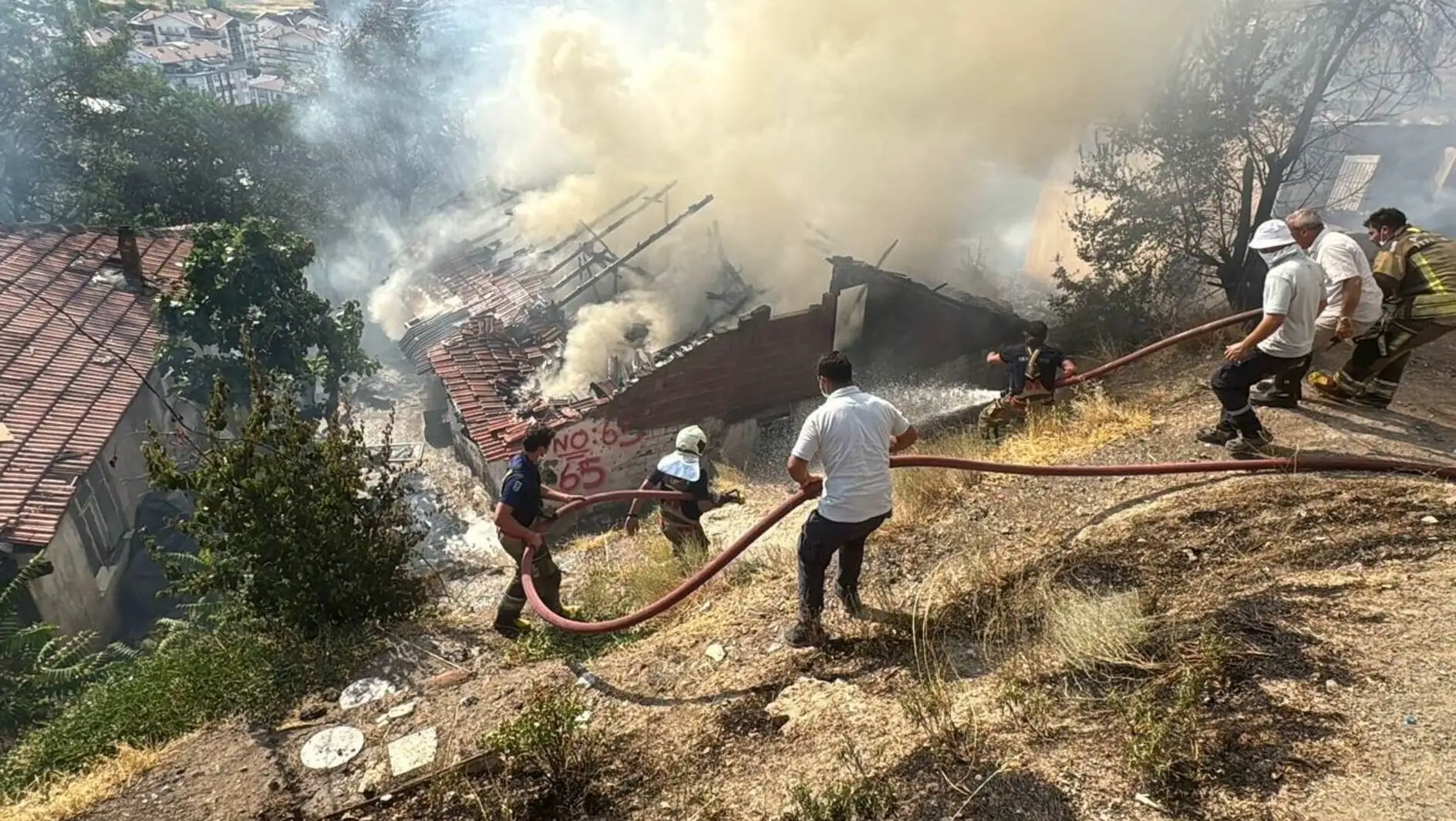 Firefighters extinguishing the fire. Firefighters extinguishing the fire.