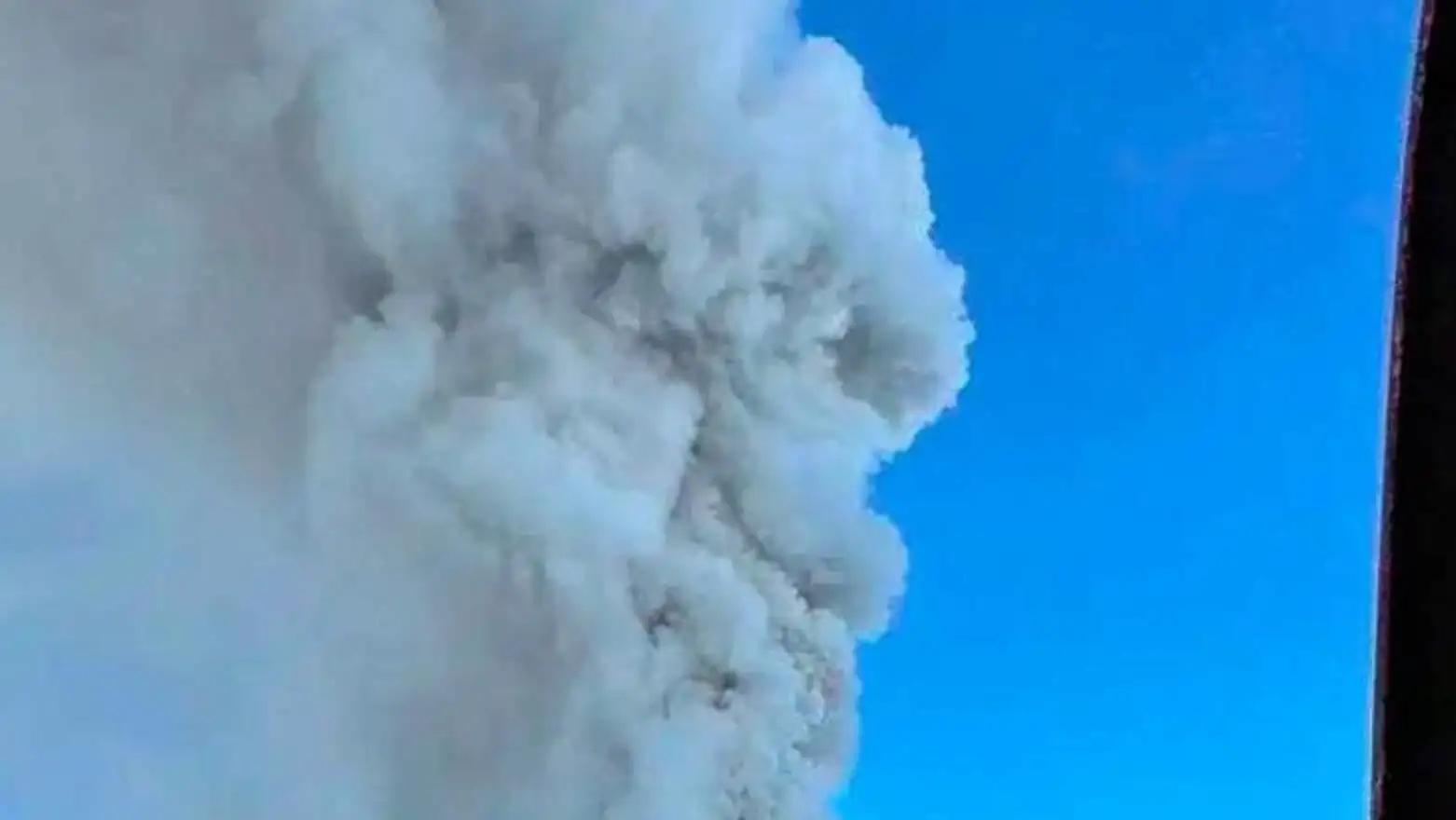 A mountain with smoke coming out of it. A mountain with smoke coming out of it.