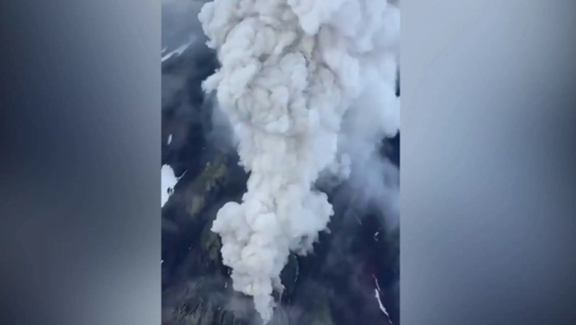 A mountain with smoke coming out of it. A mountain with smoke coming out of it.