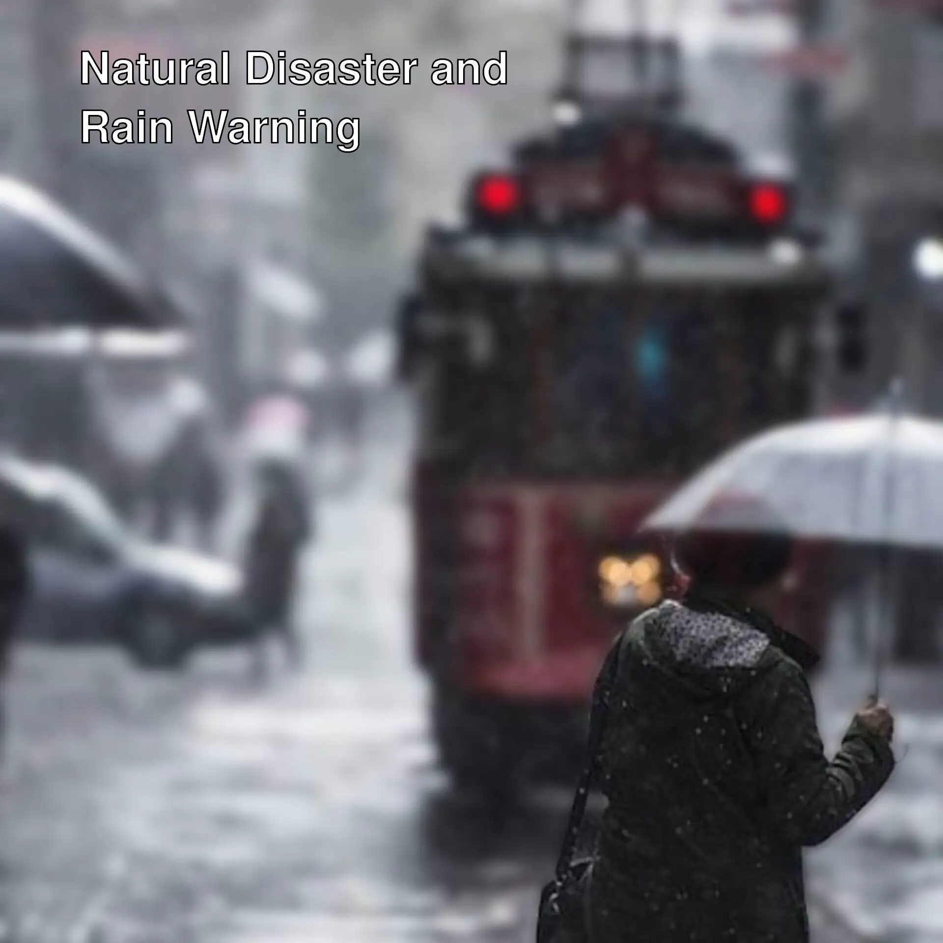 A person holding an umbrella in the rain.